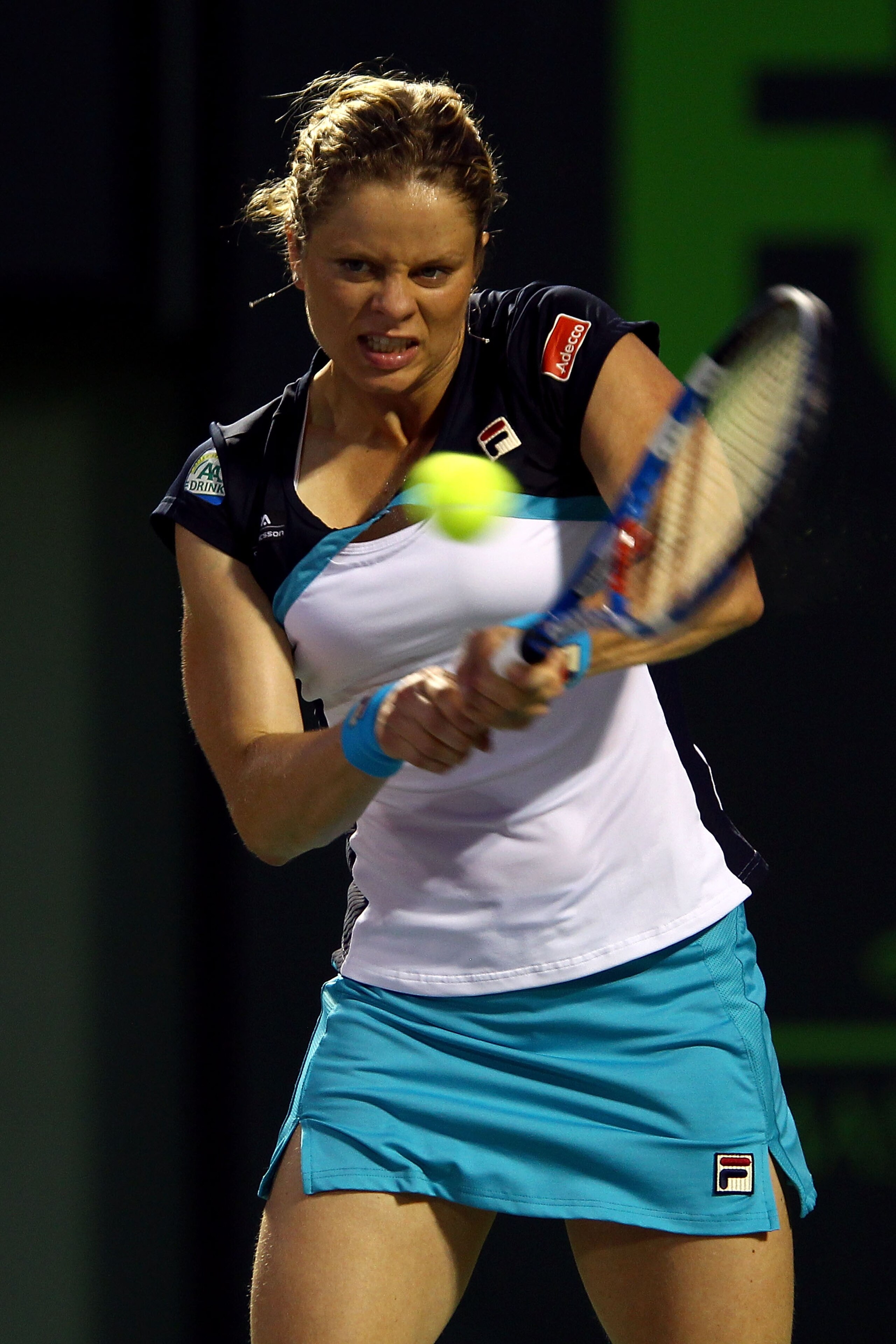 KEY BISCAYNE, FL - MARCH 30:  Kim Clijsters of Belgium hits a backhand return against Victoria Azarenka of Belarus during the Sony Ericsson Open at Crandon Park Tennis Center on March 30, 2011 in Key Biscayne, Florida.  (Photo by Clive Brunskill/Getty Ima