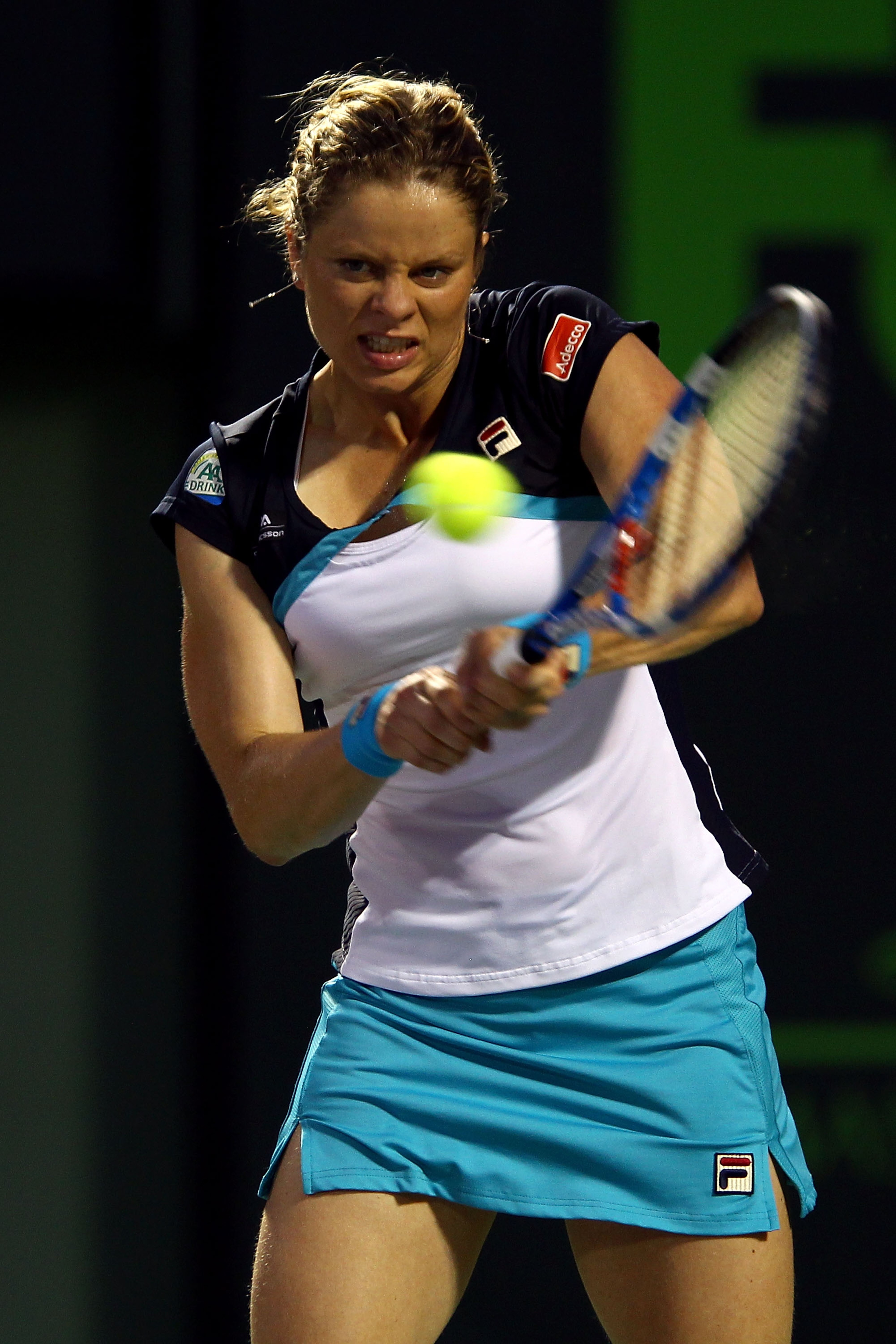 KEY BISCAYNE, FL - MARCH 30:  Kim Clijsters of Belgium hits a backhand return against Victoria Azarenka of Belarus during the Sony Ericsson Open at Crandon Park Tennis Center on March 30, 2011 in Key Biscayne, Florida.  (Photo by Clive Brunskill/Getty Ima