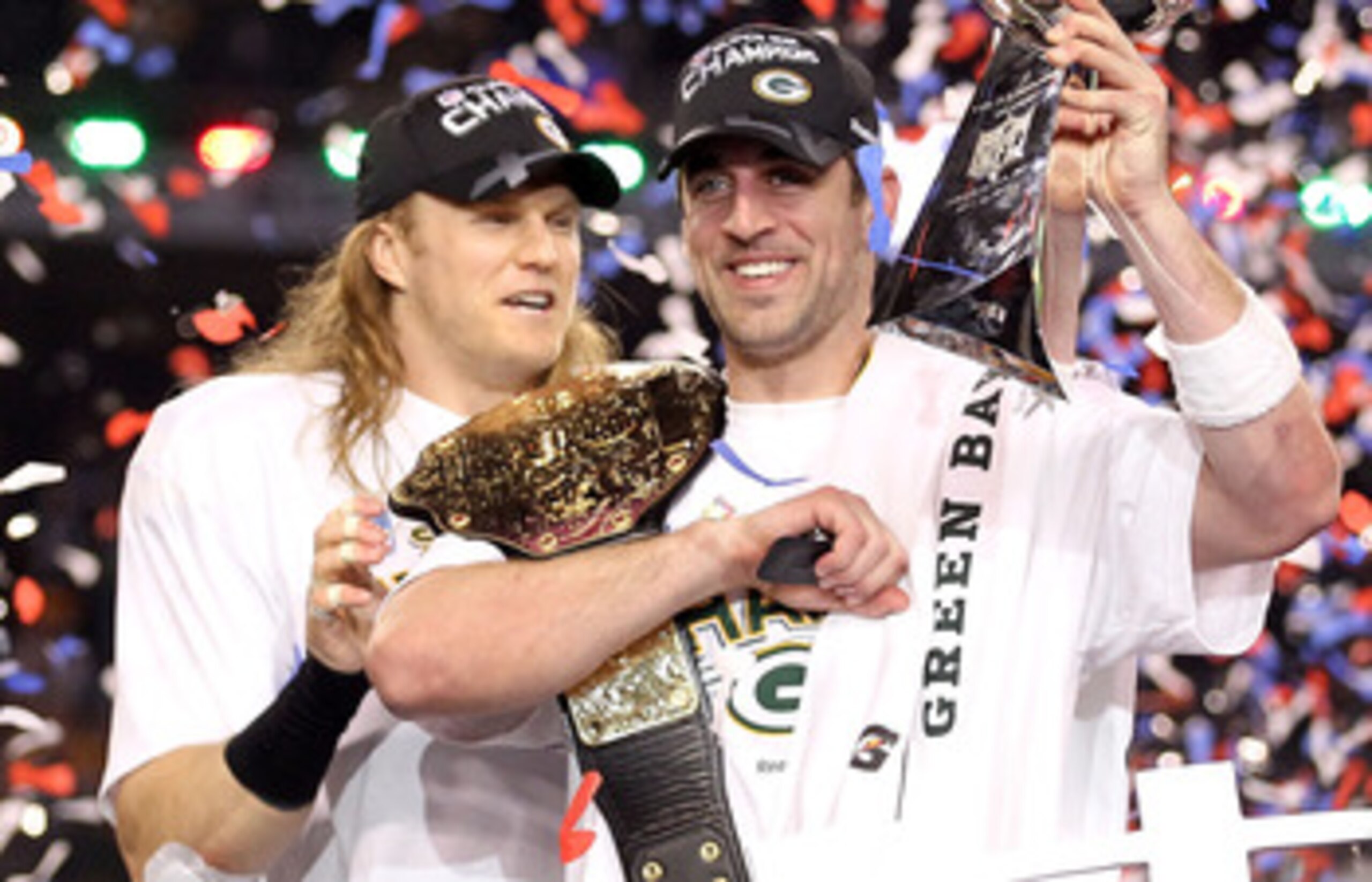 ARLINGTON, TX - FEBRUARY 06:  Super Bowl MVP Aaron Rodgers #12 (R) and Clay Matthews #52 of the Green Bay Packers celebrate with the Lombardi Trophy after winning Super Bowl XLV 31-25 against the Pittsburgh Steelers at Cowboys Stadium on February 6, 2011