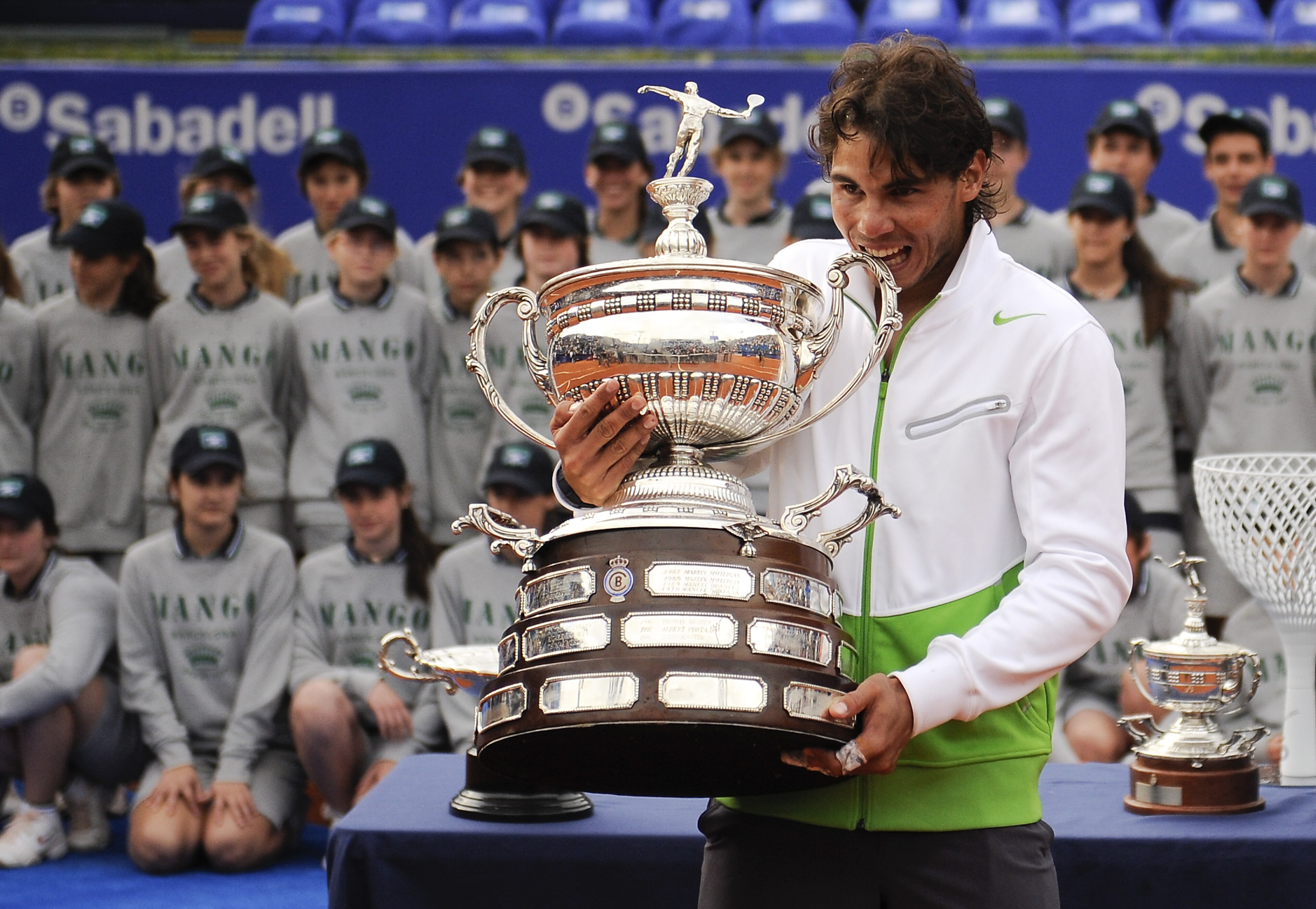 BARCELONA, SPAIN - APRIL 24:  Rafael Nadal of Spain bites the trophy after beating David Ferrer during the final match on day seven of the ATP 500 World Tour Barcelona Open Banco Sabadell 2011 tennis tournament at the Real Club de Tenis on April 24, 2011