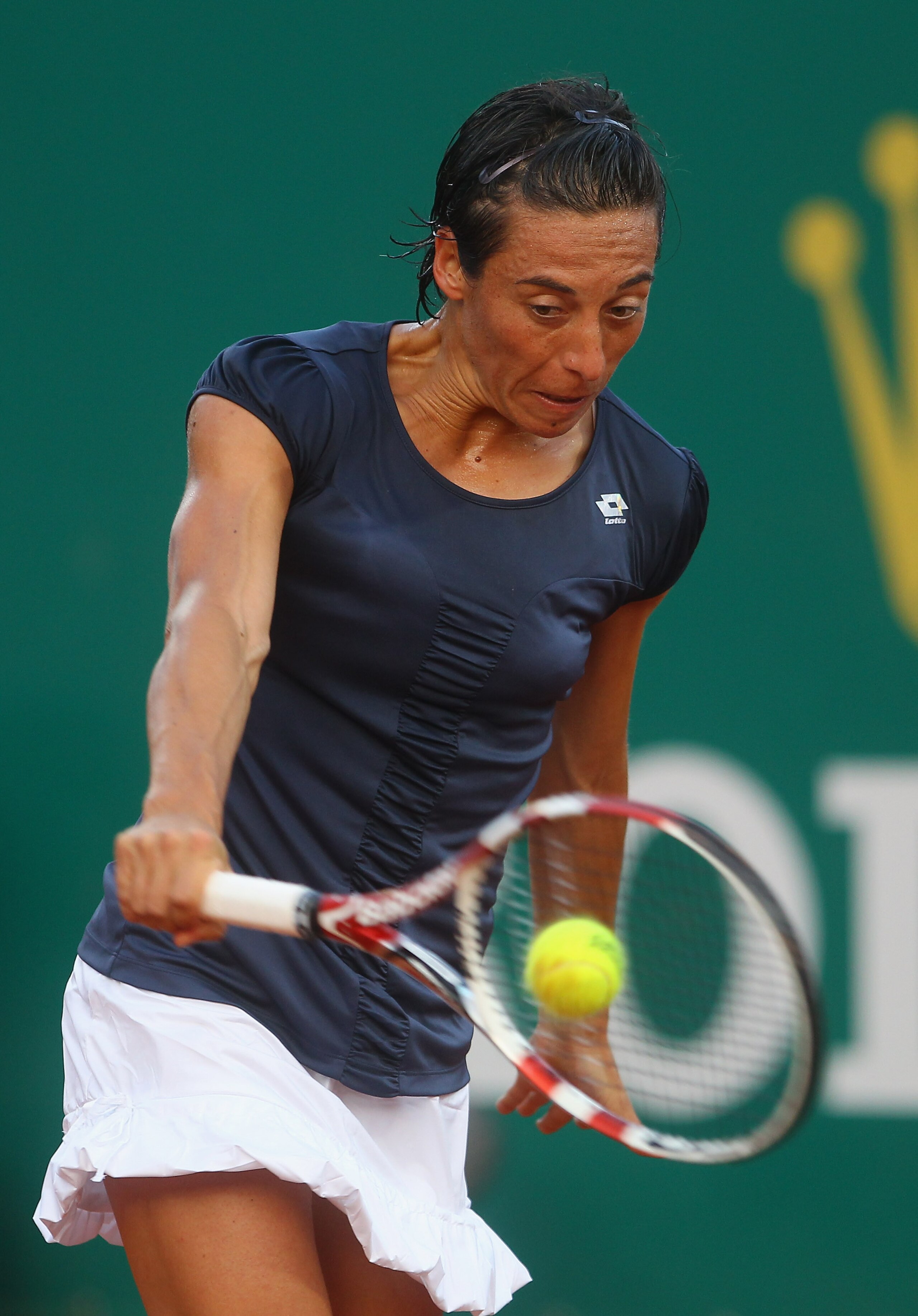 MONACO - APRIL 11:  Francesca Schiavone of Italy in action against Caroline Wozniacki of Denmark in the womens exhibition match during Day Two of the ATP Masters Series Tennis at the Monte Carlo Country Club on April 11, 2011 in Monte Carlo, Monaco.  (Pho