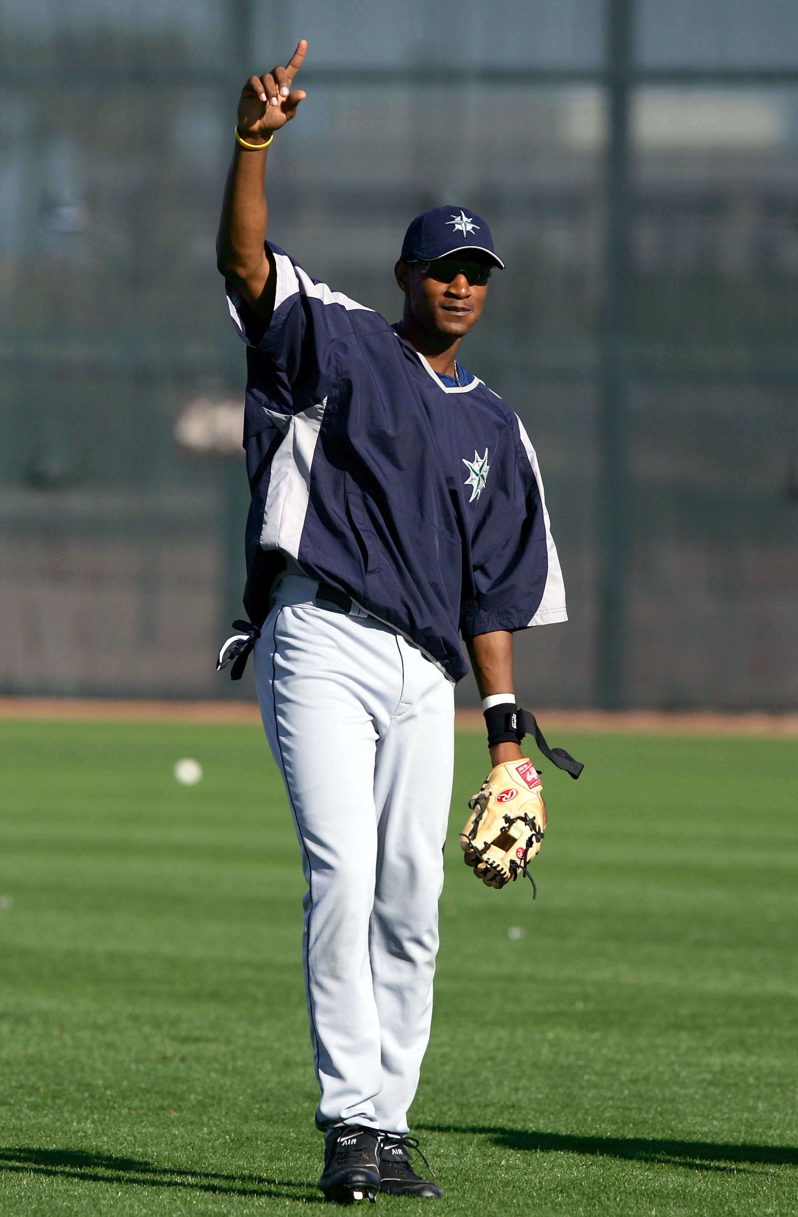 PEORIA, AZ - FEBRUARY 27:  Adam Jones #83 of the Seattle Mariners signals his teammates during preseason training on February 27, 2005 at Peoria Stadium in Peoria, Arizona. (Photo by Lisa Blumenfeld/Getty Images)