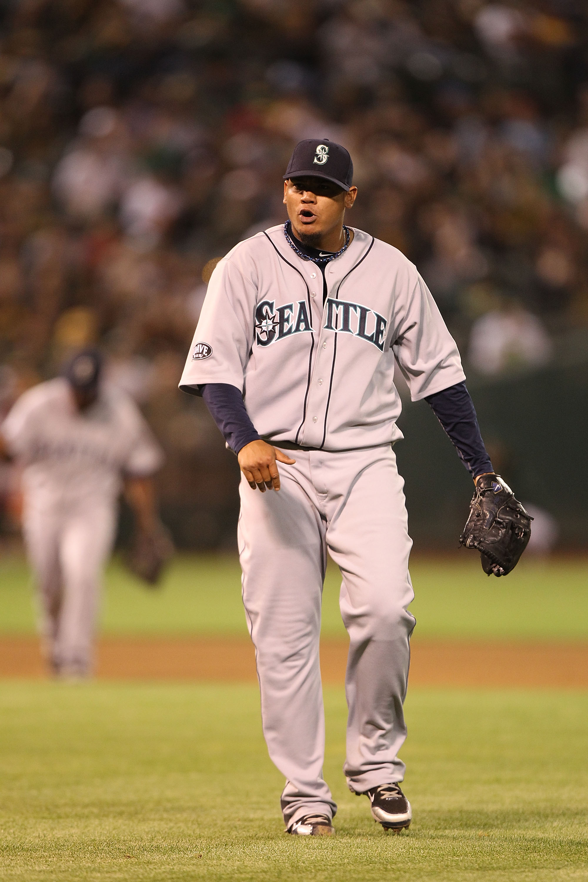 OAKLAND, CA - APRIL 01:  Felix Hernandez #34 of the Seattle Mariners celebrates at the end of the eighth inning against the Oakland Athletics during an opening day game of Major League Baseball at the Oakland-Alameda County Coliseum on April 1, 2011 in Oa