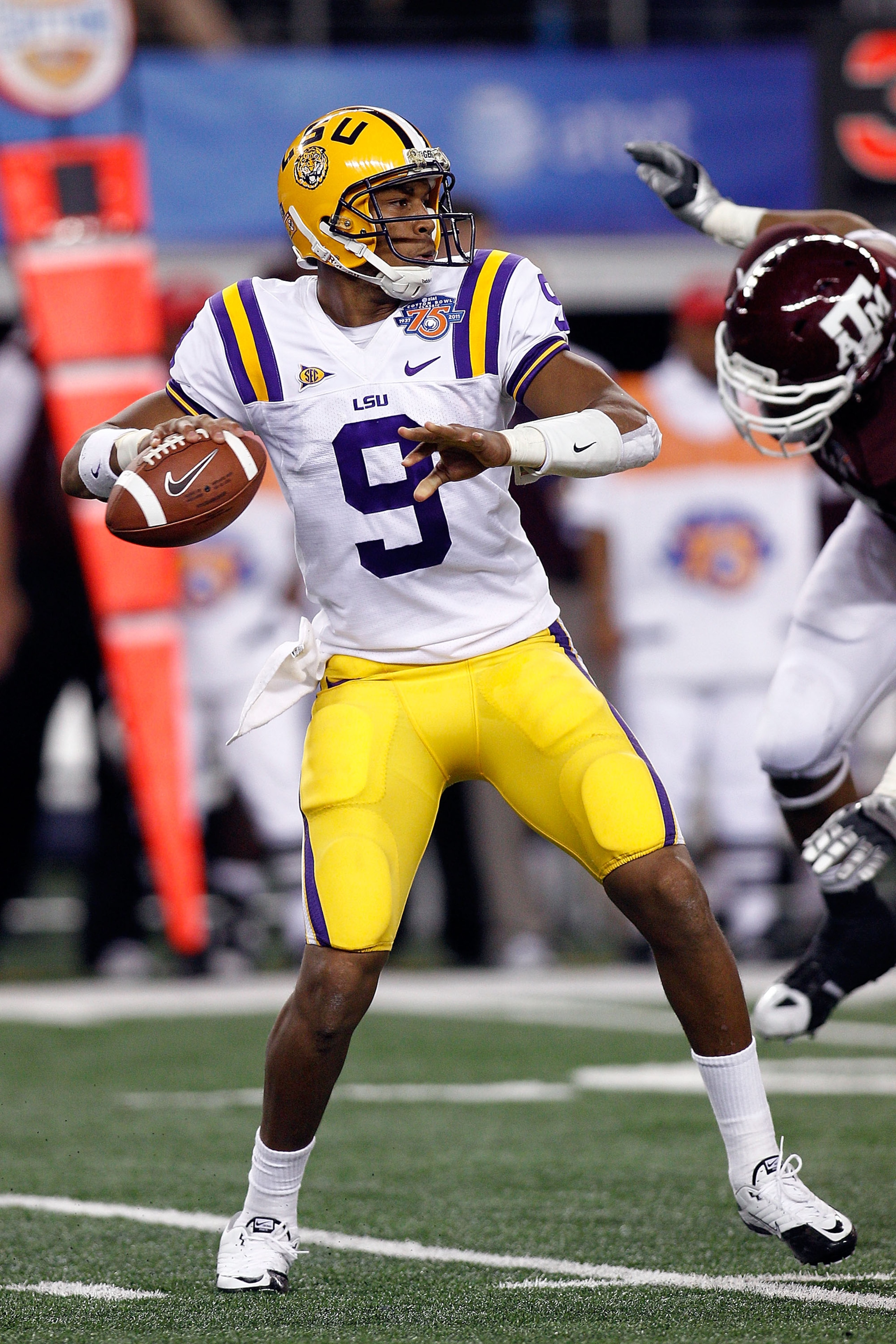 ARLINGTON, TX - JANUARY 07:  Jordan Jefferson #9 of the Louisiana State University Tigers looks to throw a pass during the game against the Texas A&M Aggies during the AT&T Cotton Bowl at Cowboys Stadium on January 7, 2011 in Arlington, Texas.  (Photo by
