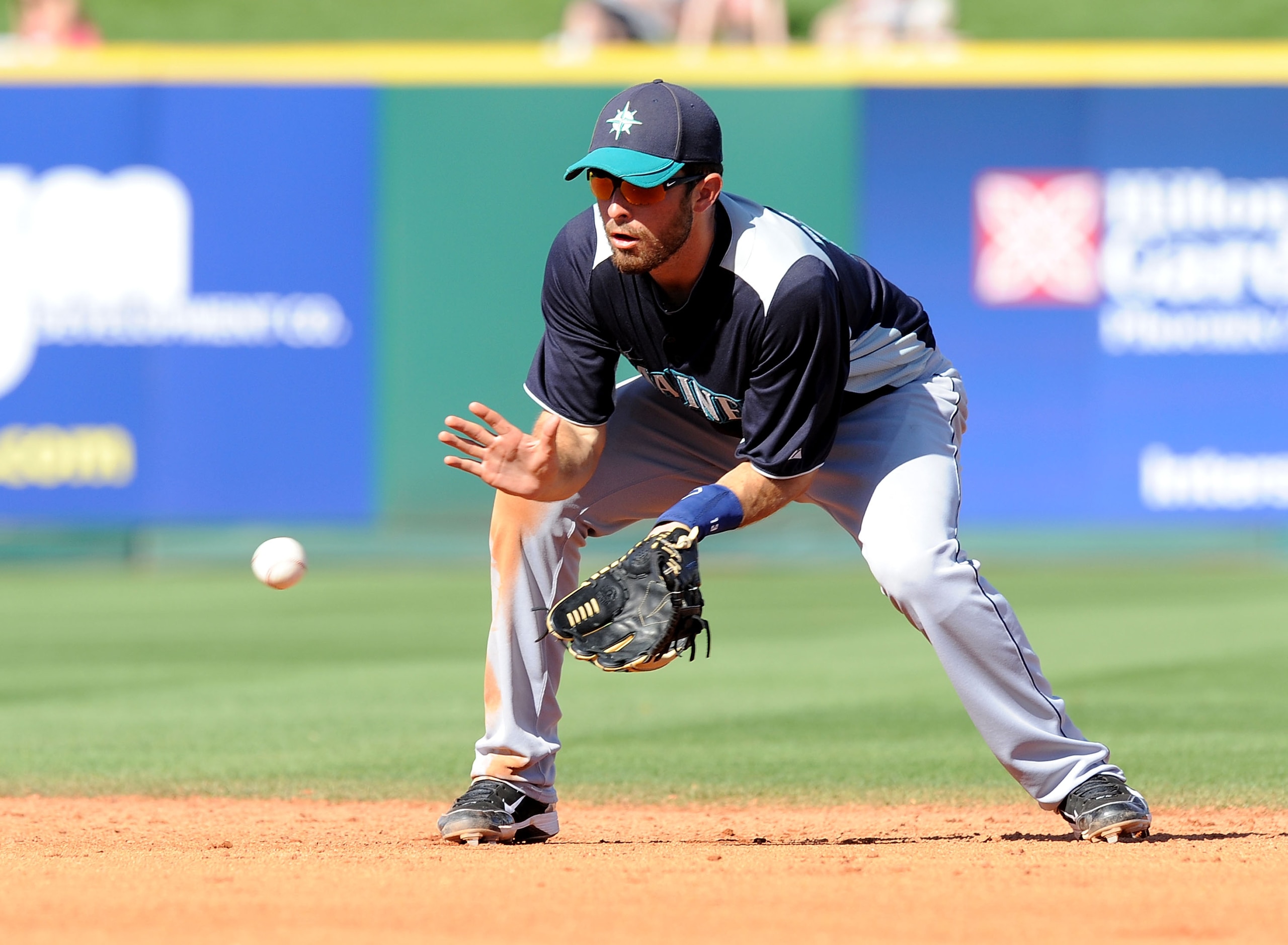 GOODYEAR, AZ - MARCH 11:  Dustin Ackley #13 of the Seattle Mariners fields a ground ball against the Cleveland Indians at Goodyear Ballpark on March 11, 2011 in Goodyear, Arizona.  (Photo by Norm Hall/Getty Images)
