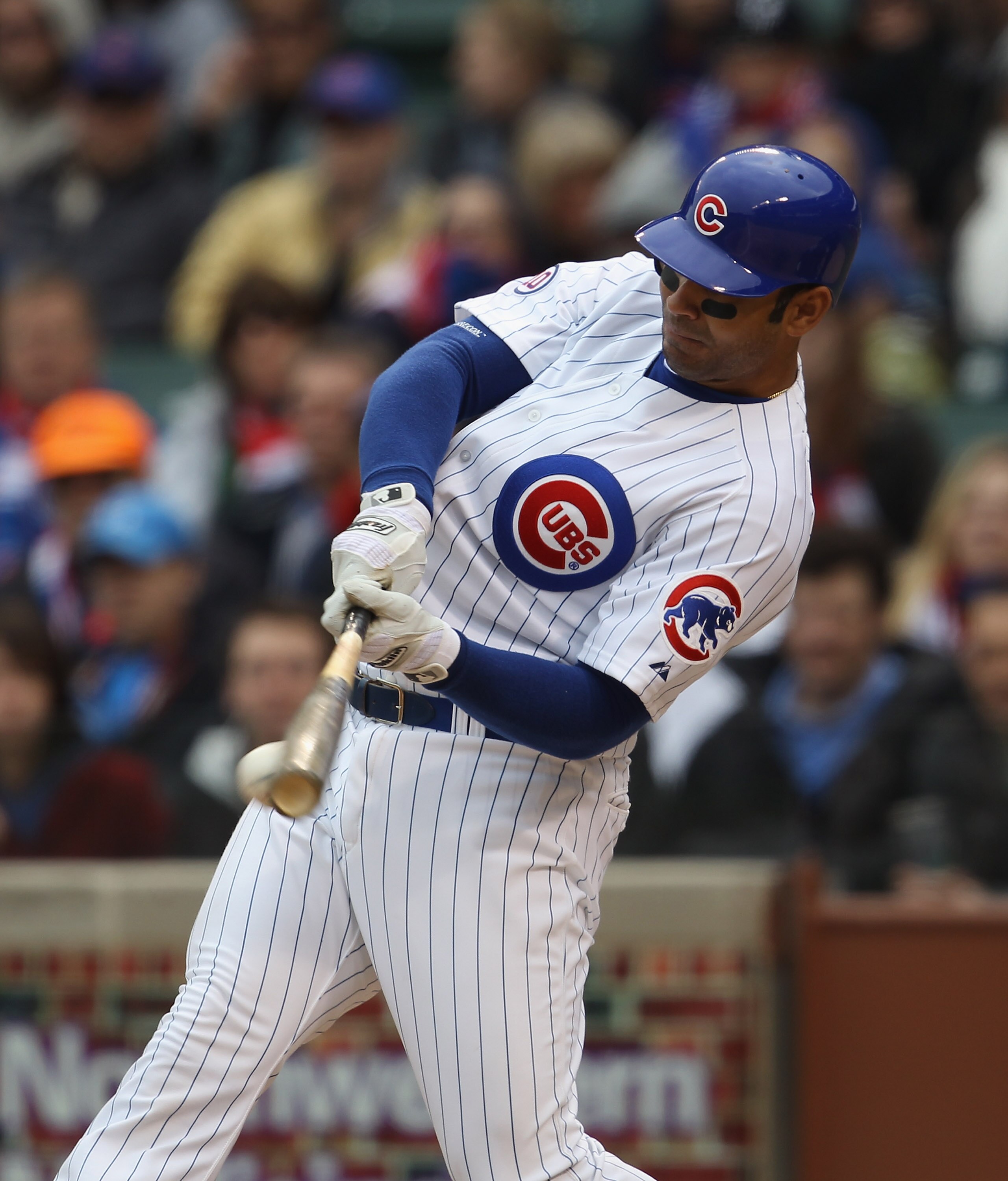 CHICAGO, IL - APRIL 20: Carlos Pena #22 of the Chicago Cubs hits the ball against the San Diego Padres at Wrigley Field on April 20, 2011 in Chicago, Illinois. The Cubs defeated the Padres 2-1 in 11 innings. (Photo by Jonathan Daniel/Getty Images)
