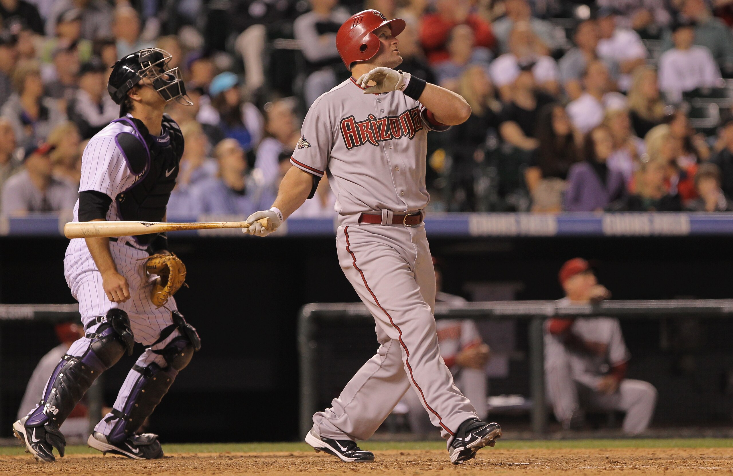 DENVER, CO - APRIL 02: Russell Branyan of the Arizona Diamondbacks watches as his fly ball to deep centerfield was caught by centerfielder Dexter Fowler of the Colorado Rockies at the wall for the second out of the ninth inning at Coors Field on April 2, DENVER, CO - APRIL 02: Russell Branyan of the Arizona Diamondbacks watches as his fly ball to deep centerfield was caught by centerfielder Dexter Fowler of the Colorado Rockies at the wall for the second out of the ninth inning at Coors Field on April 2,