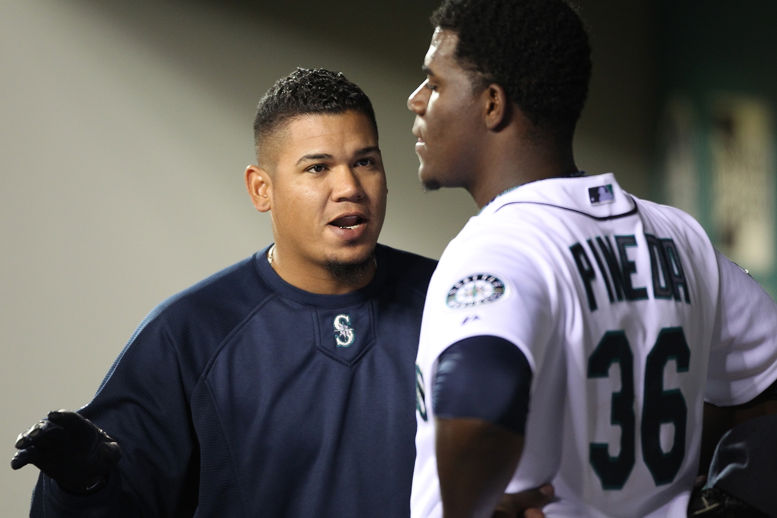 SEATTLE - APRIL 12:  Felix Hernandez #34 of the Seattle Mariners talks with starting pitcher Michael Pineda #36 after he was removed from the game in the eighth inning against the Toronto Blue Jays at Safeco Field on April 12, 2011 in Seattle, Washington.
