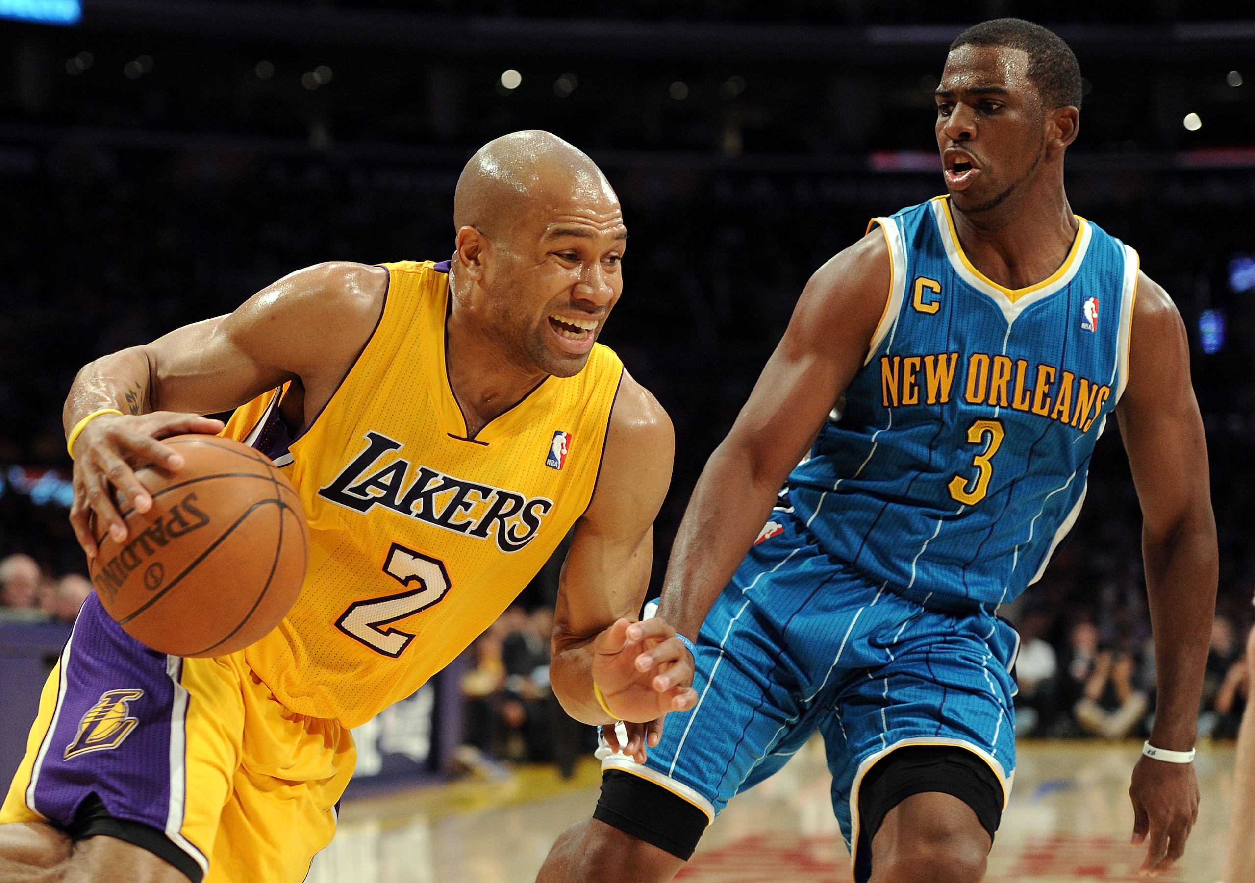 LOS ANGELES, CA - APRIL 20:  Derek Fisher #2 of the Los Angeles Lakers drives on Chris Paul #3 of the New Orleans Hornets in the first quarter in Game Two of the Western Conference Quarterfinals in the 2011 NBA Playoffs on April 20, 2011 at Staples Center