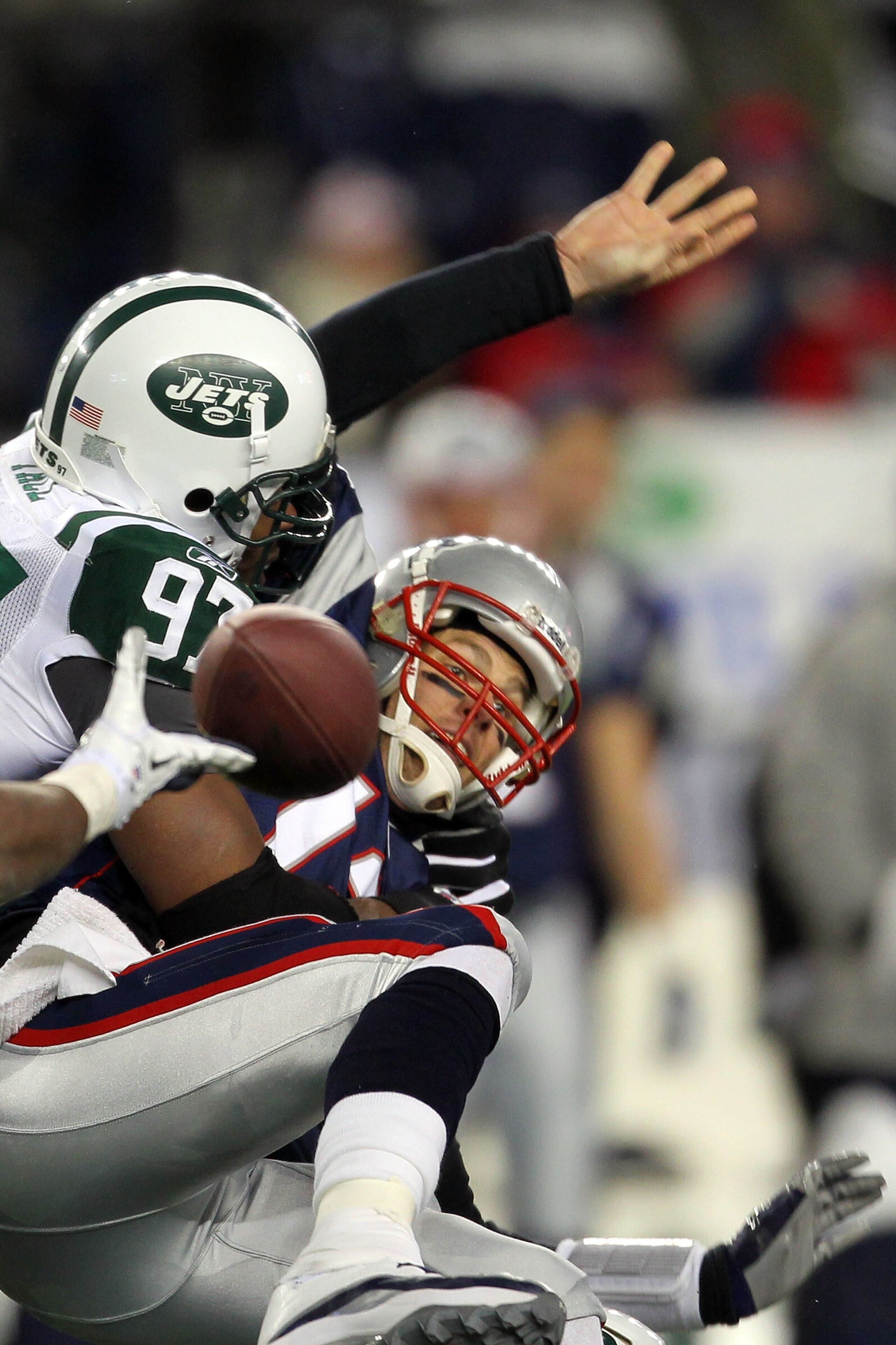 FOXBORO, MA - JANUARY 16: Tom Brady #12 of the New England Patriots looses the ball as he is sacked by Calvin Pace #97 of the New York Jets in the third quarter of their 2011 AFC divisional playoff game at Gillette Stadium on January 16, 2011 in Foxboro, FOXBORO, MA - JANUARY 16: Tom Brady #12 of the New England Patriots looses the ball as he is sacked by Calvin Pace #97 of the New York Jets in the third quarter of their 2011 AFC divisional playoff game at Gillette Stadium on January 16, 2011 in Foxboro,