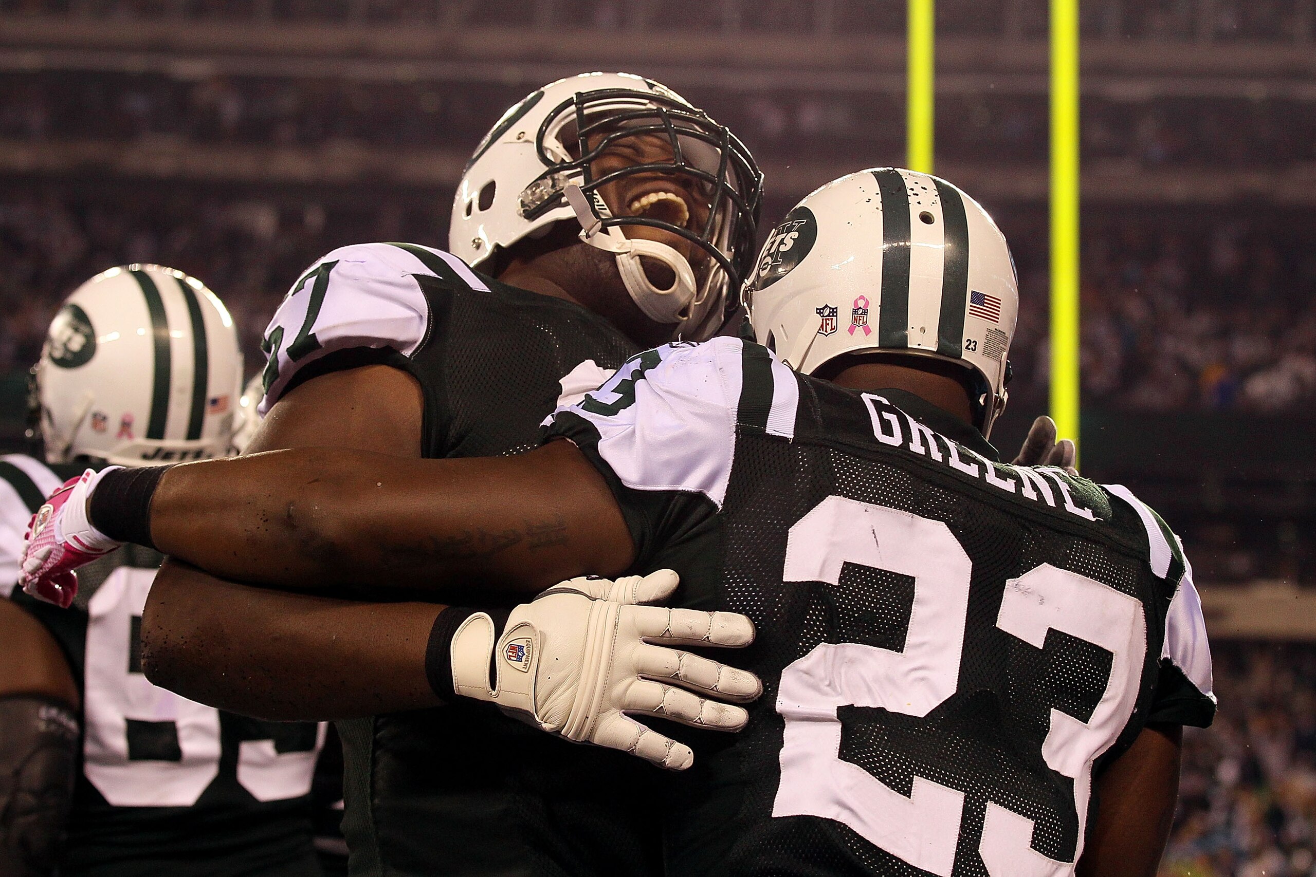 EAST RUTHERFORD, NJ - OCTOBER 11: (L-R) Damien Woody #67 and Shonn Greene #23 of the New York Jets celebrates after Greene scored a 23-yard rushing touchdown in the fourth quarter against the Minnesota Vikings at New Meadowlands Stadium on October 11, 20 EAST RUTHERFORD, NJ - OCTOBER 11: (L-R) Damien Woody #67 and Shonn Greene #23 of the New York Jets celebrates after Greene scored a 23-yard rushing touchdown in the fourth quarter against the Minnesota Vikings at New Meadowlands Stadium on October 11, 20