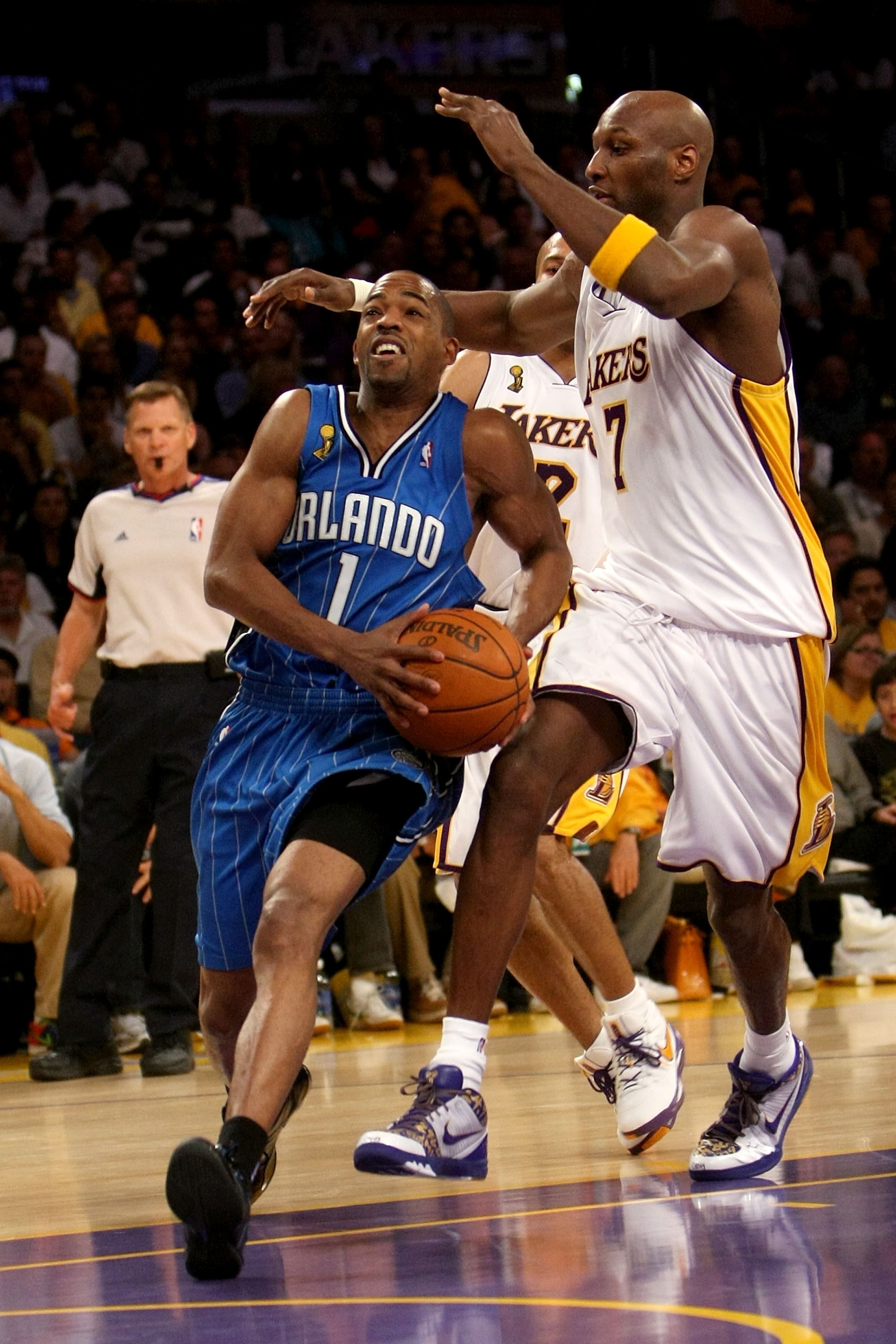 LOS ANGELES, CA - JUNE 07:  Rafer Alston #1 of the Orlando Magic drives to the basket past Lamar Odom #7  of the Los Angeles Lakers in Game Two of the 2009 NBA Finals at Staples Center on June 7, 2009 in Los Angeles, California. NOTE TO USER: User express