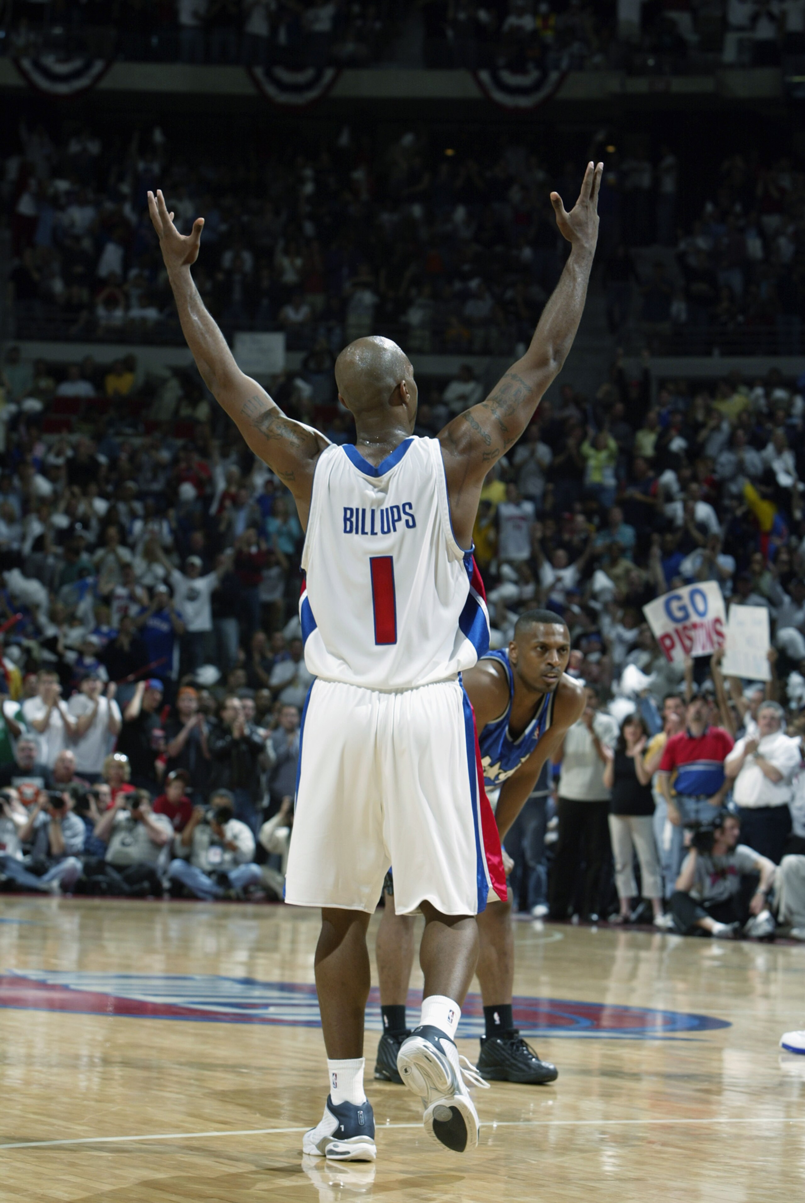 AUBURN HILLS, MI - MAY 4:  Chauncey Billups #1 of the Detroit Pistons raises his arms in celebration in Game seven of the Eastern Conference Quarterfinals against the Orlando Magic during the 2003 NBA Playoffs at The Palace of Auburn Hills on May 4, 2003