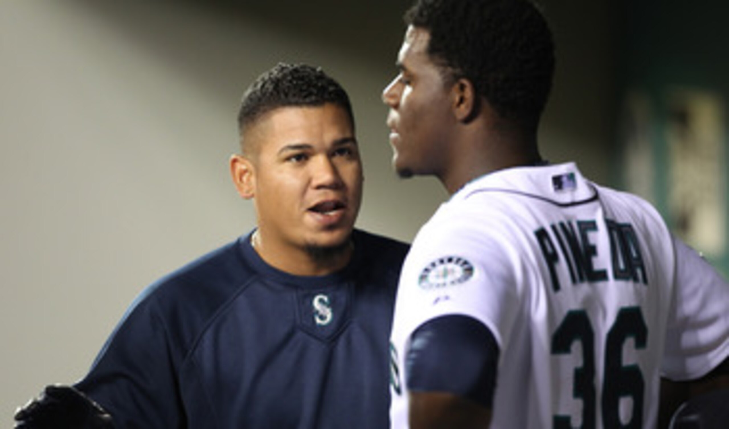 SEATTLE - APRIL 12:  Felix Hernandez #34 of the Seattle Mariners talks with starting pitcher Michael Pineda #36 after he was removed from the game in the eighth inning against the Toronto Blue Jays at Safeco Field on April 12, 2011 in Seattle, Washington.