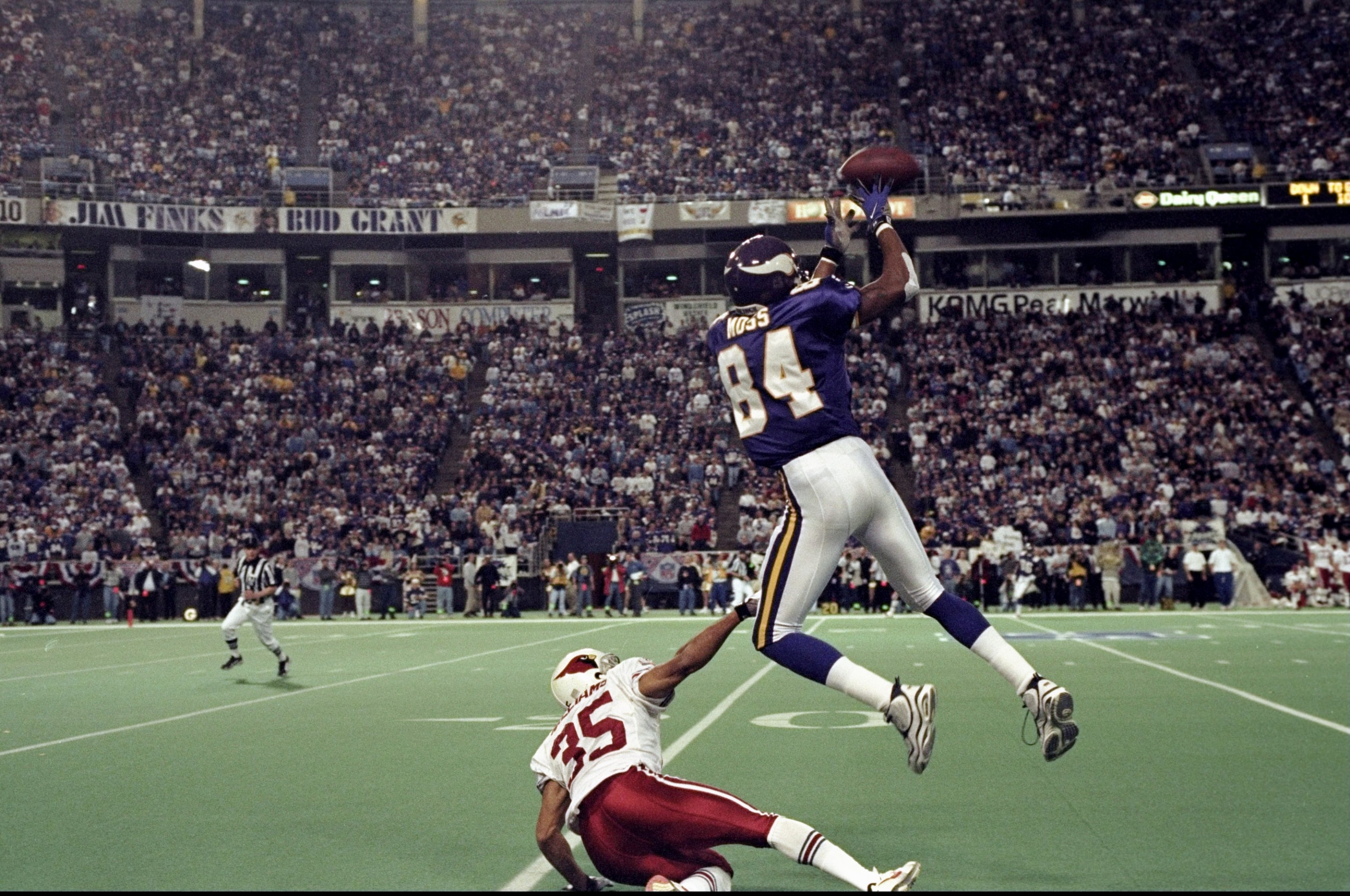 10 Jan 1999: Randy Moss #84 of the Minnesota Vikings goes up for a pass over Aeneas Williams #35 of the Arizona Cardinals during their NFC play-off game at the H. H. H. Metrodome in Minneapolis, Minnesota. The Vikings defeated the Cardinals 41-21. 10 Jan 1999: Randy Moss #84 of the Minnesota Vikings goes up for a pass over Aeneas Williams #35 of the Arizona Cardinals during their NFC play-off game at the H. H. H. Metrodome in Minneapolis, Minnesota. The Vikings defeated the Cardinals 41-21.