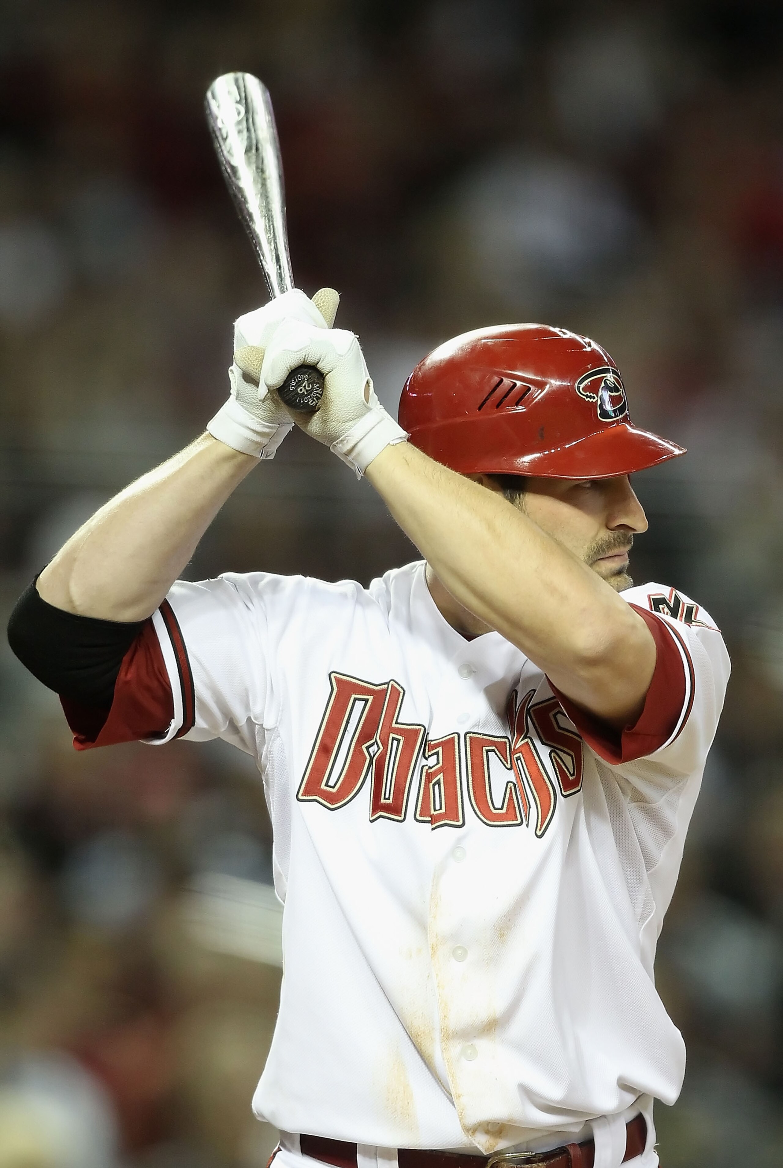 PHOENIX, AZ - APRIL 08:  Xavier Nady #22 of the Arizona Diamondbacks bats against the Cincinnati Reds during the Major League Baseball home opening game at Chase Field on April 8, 2011 in Phoenix, Arizona. The Diamondbacks defeated the Reds 13-2.  (Photo