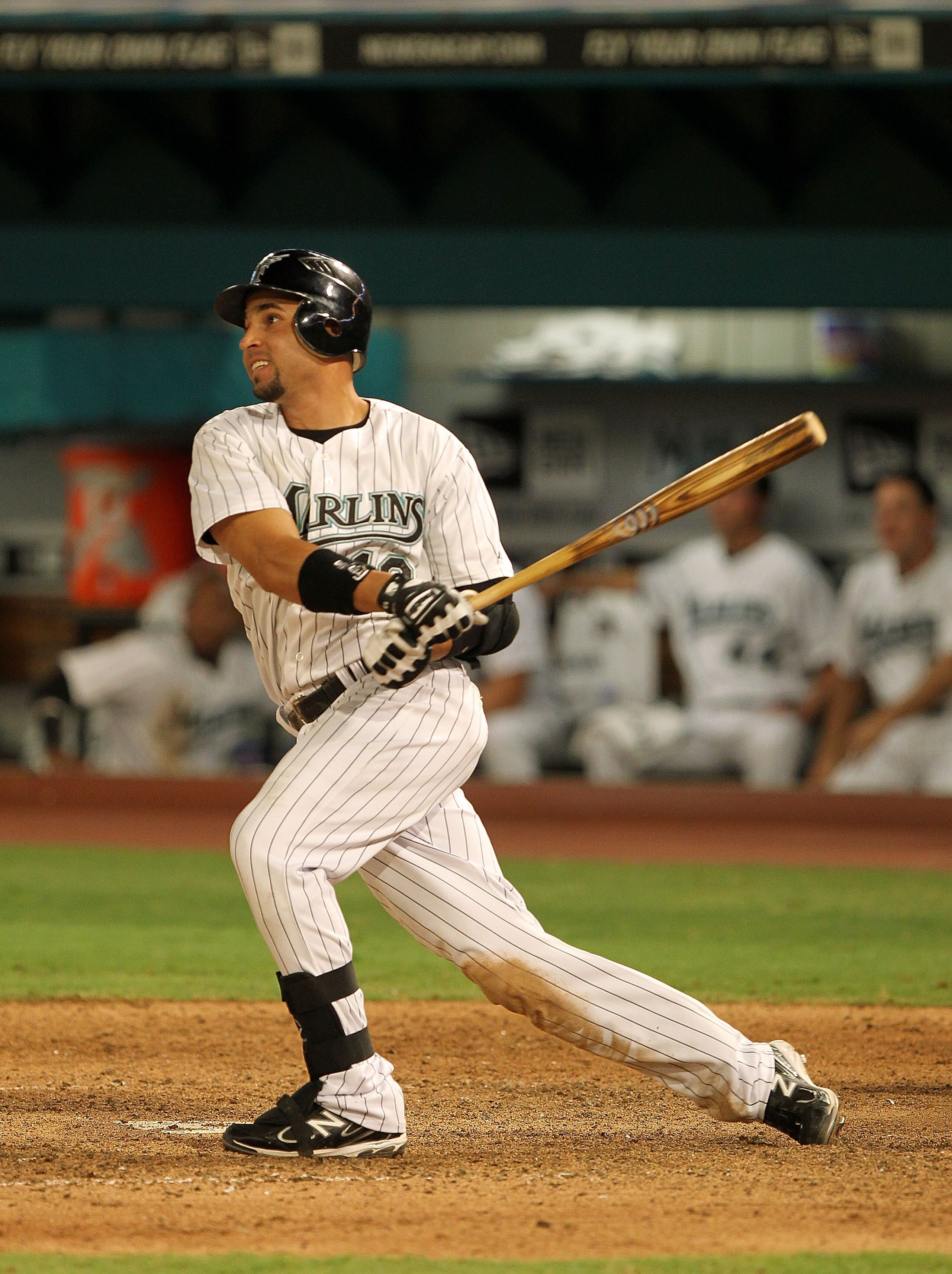 MIAMI GARDENS, FL - APRIL 25:  Omar Infante #13 of the Florida Marlins hits a walk off single during a game against the Los Angeles Dodgers at Sun Life Stadium on April 25, 2011 in Miami Gardens, Florida.  (Photo by Mike Ehrmann/Getty Images)