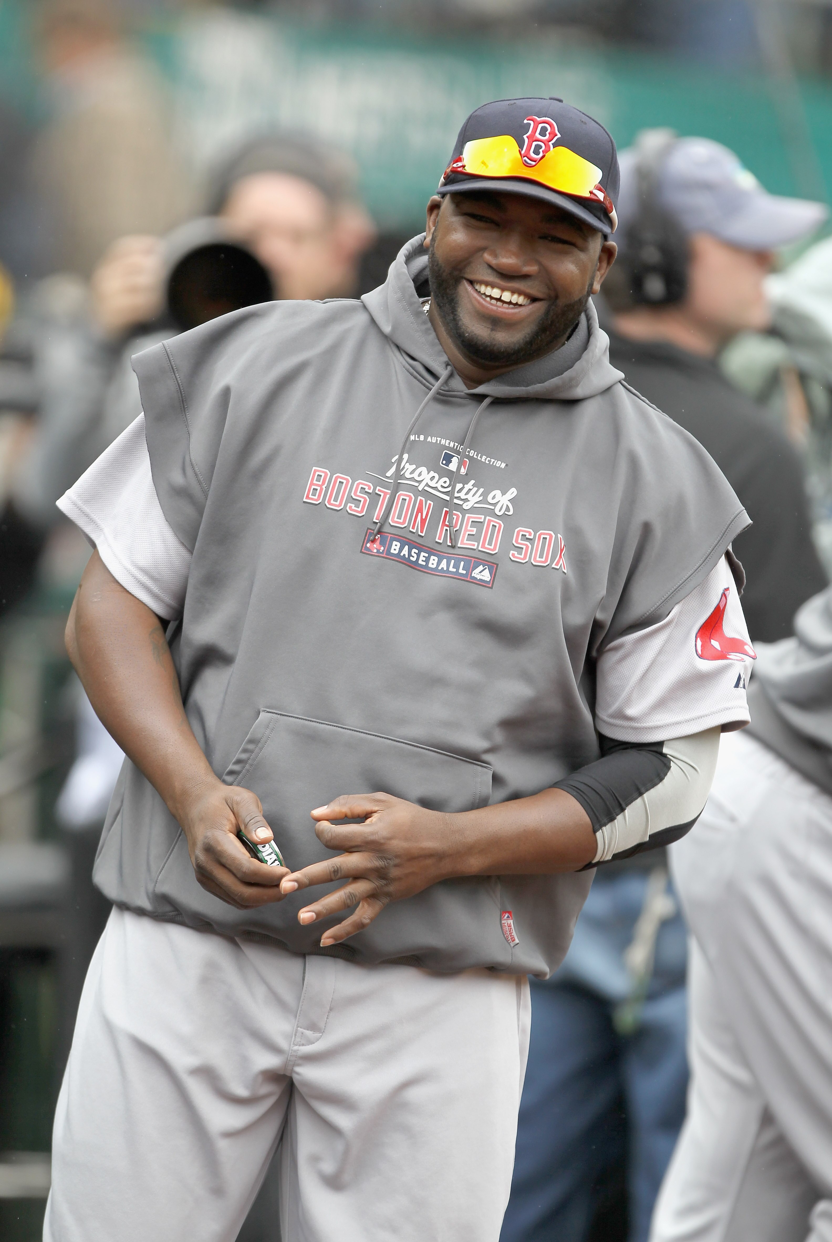 OAKLAND, CA - APRIL 20:  David Ortiz #34 of the Boston Red Sox smiles in the dugout before their game against the Oakland Athletics at Oakland-Alameda County Coliseum on April 20, 2011 in Oakland, California.  (Photo by Ezra Shaw/Getty Images)