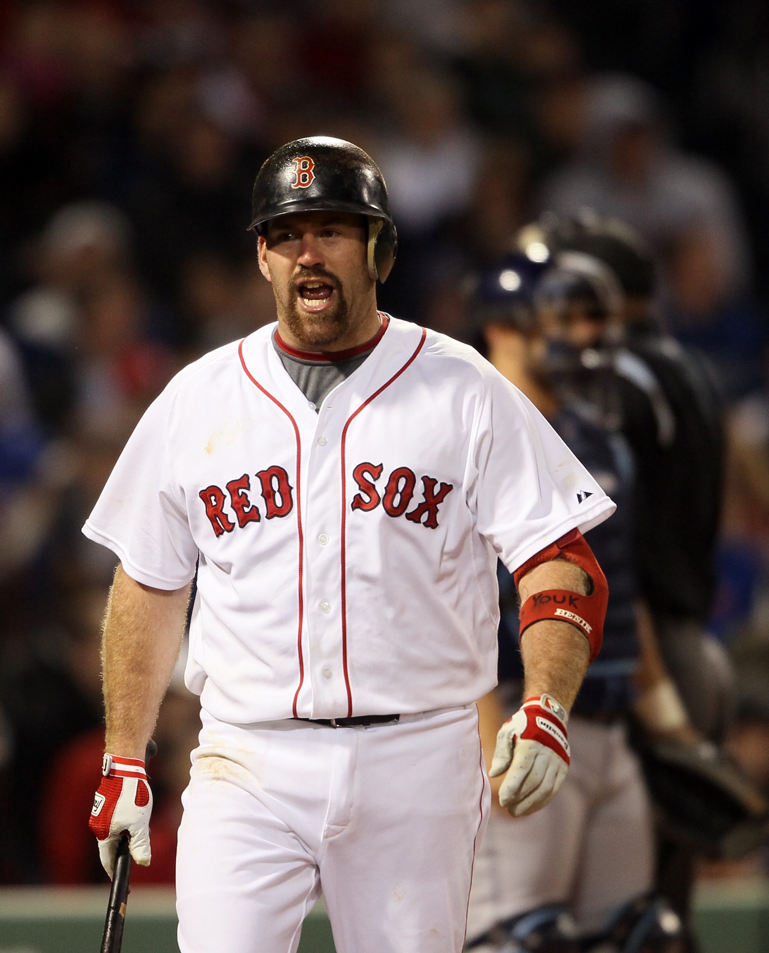 BOSTON, MA - APRIL 12:  Kevin Youkilis #20 of the Boston Red Sox reacts to his strikeout in the sixth inning against the Tampa Bay Rays on April 12, 2011 at Fenway Park in Boston, Massachusetts.  (Photo by Elsa/Getty Images)