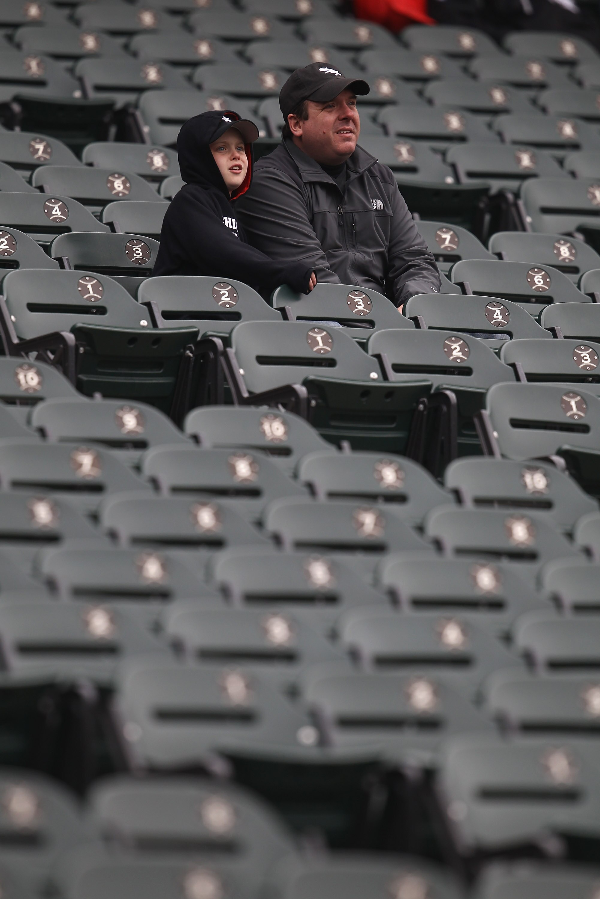 CHICAGO, IL - APRIL 07: Fans of the Chicago White Sox watch batting practice in their seats before the home opener against the Tampa Bay Rays at U.S. Cellular Field on April 7, 2011 in Chicago, Illinois. (Photo by Jonathan Daniel/Getty Images)