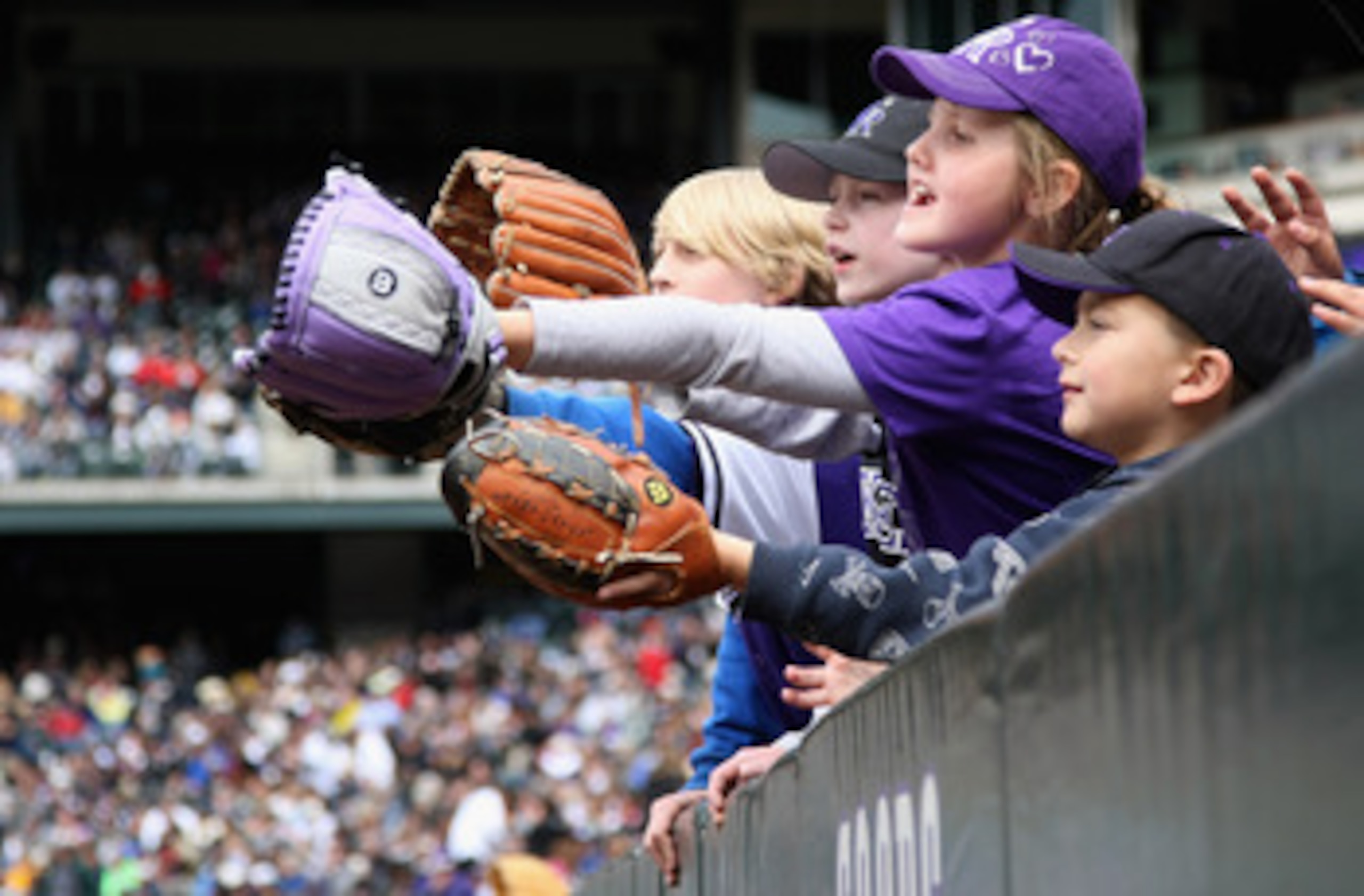 DENVER, CO - MAY 01:  Young fans hope to get a souvenir ball as the Colorado Rockies host the Pittsburgh Pirates at Coors Field on May 1, 2011 in Denver, Colorado. The Pirates defeated the Rockies 8-4.  (Photo by Doug Pensinger/Getty Images)
