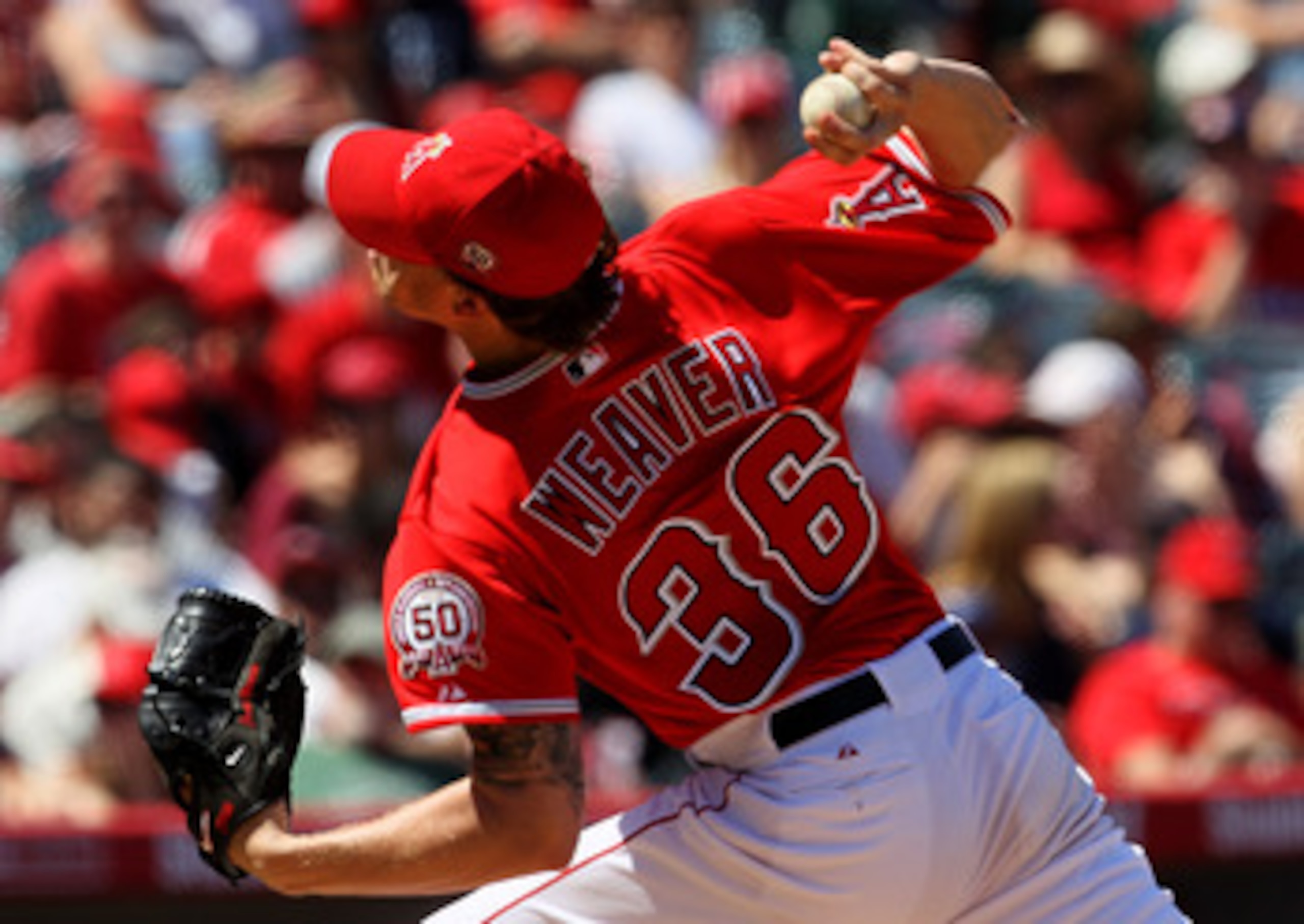 ANAHEIM, CA - APRIL 10:  Jered Weaver #36 of the Los Angeles Angels of Anaheim throws a pitch against the Toronto Blue Jays on April 10, 2011 at Angel Stadium in Anaheim, California. The Angels won 3-1.  (Photo by Stephen Dunn/Getty Images)