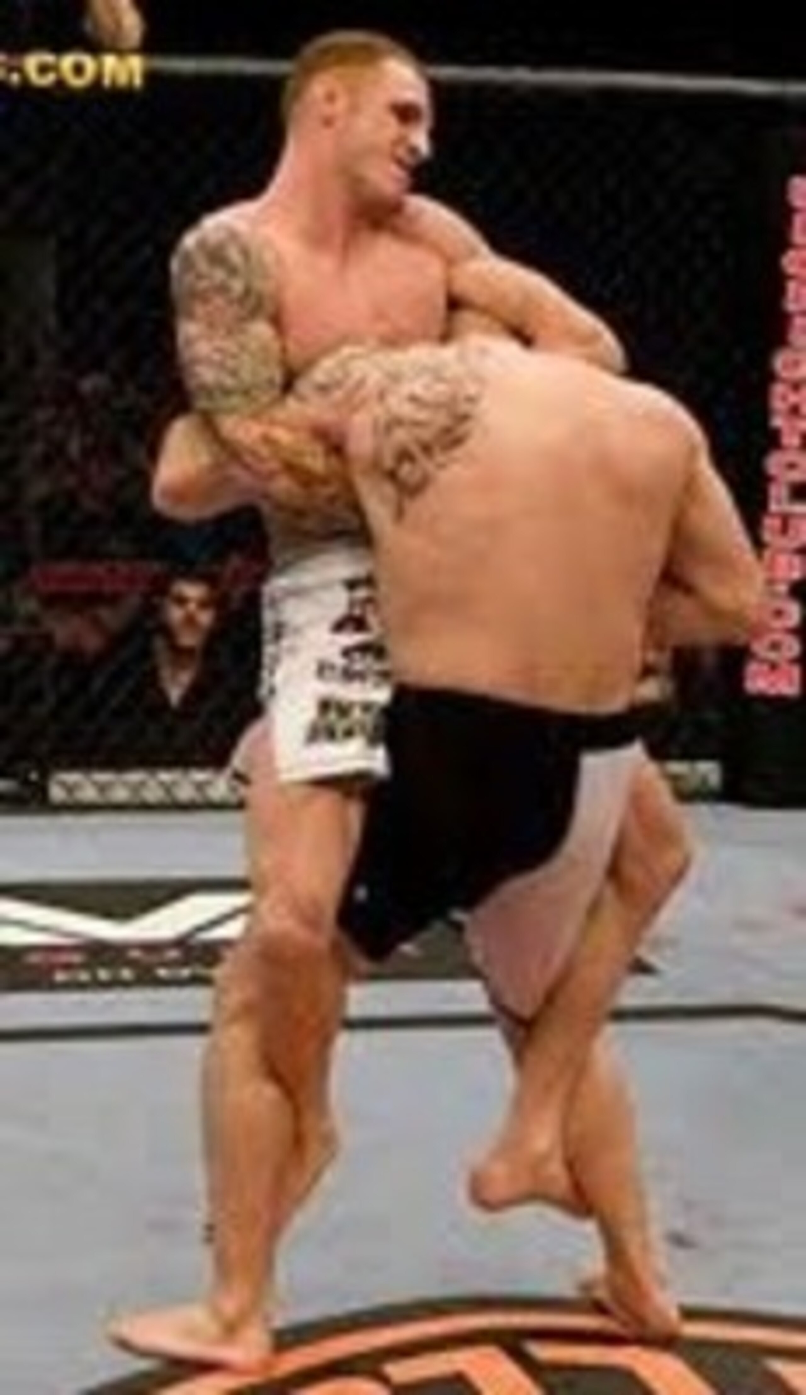 Jason MacDonald running a guillotine choke