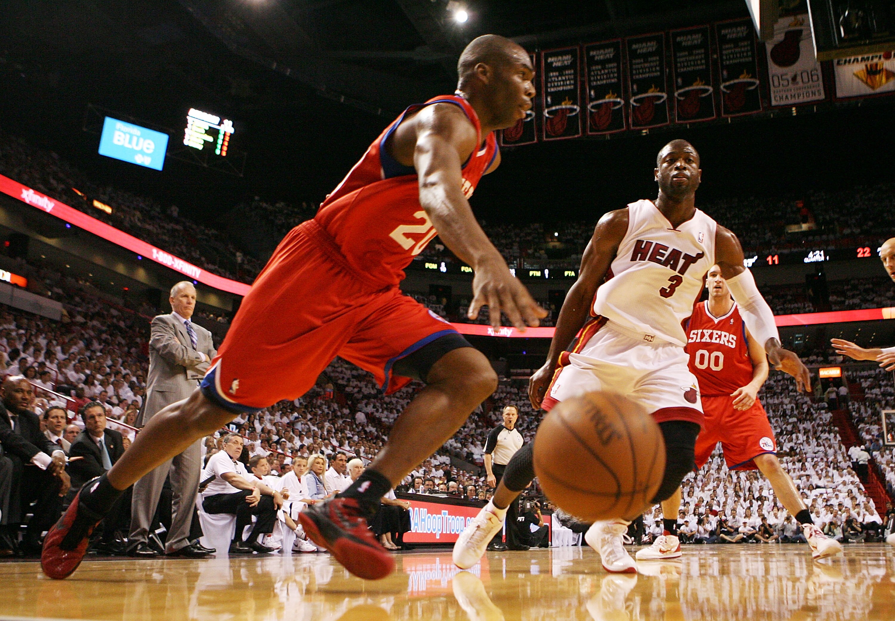 MIAMI, FL - APRIL 16:  Guard Dwyane Wade #3 of the Miami Heat defends against guard Jodie Meeks #20 of  the Philadelphia 76ers at the American Airlines Arena in game one of the Eastern Conference Quarterfinals in the 2011 NBA Playoffs on April 16, 2011 in