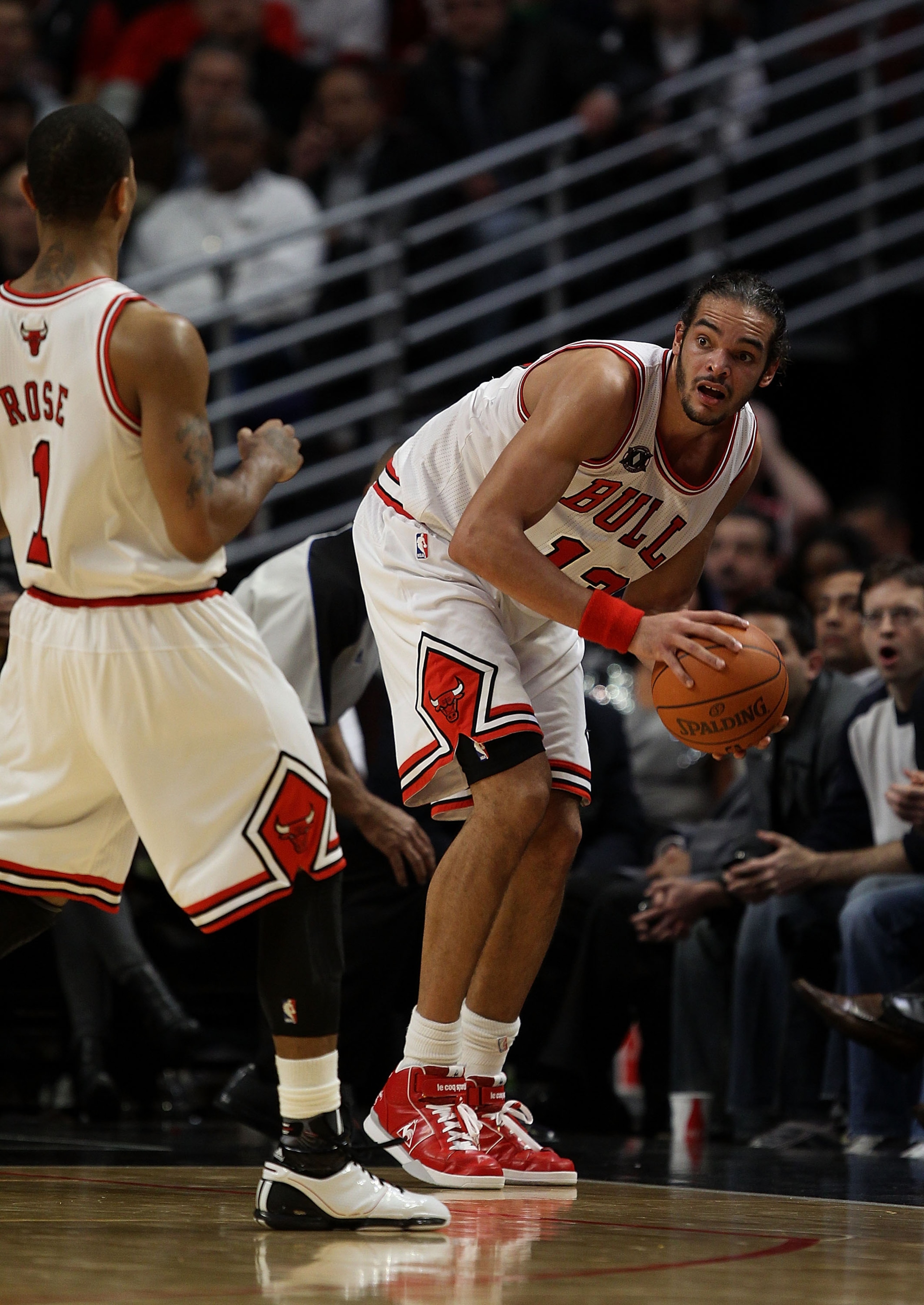 CHICAGO - NOVEMBER 04: Joakim Noah #13 of the Chicago Bulls looks to pass to Derrick Rose #1 after chasing down the ball against the New York Knicks at the United Center on November 4, 2010 in Chicago, Illinois. The Knicks defeated the Bulls 120-112. NOTE