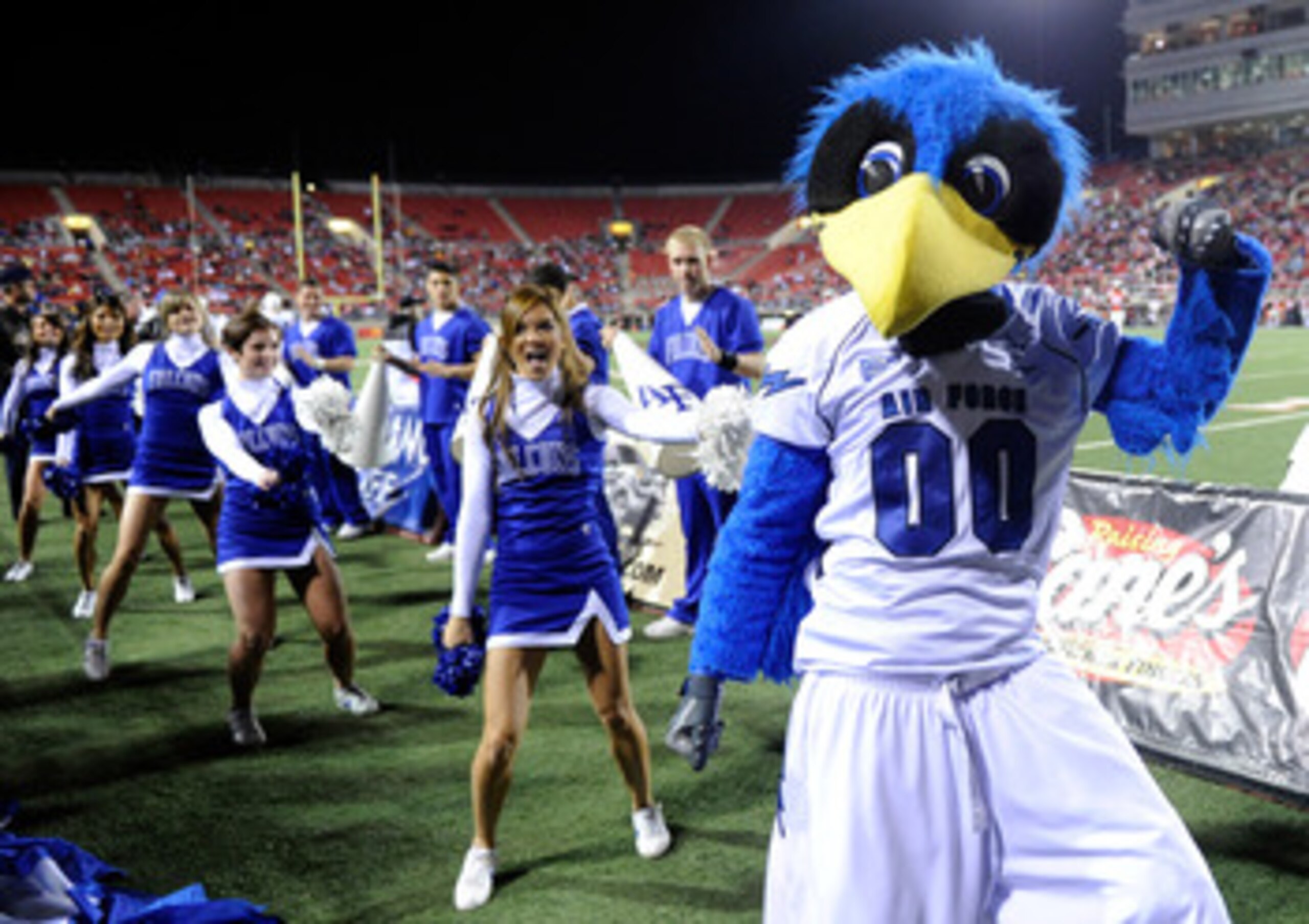 LAS VEGAS - NOVEMBER 18: The Air Force Falcons mascot The Bird performs with cheerleaders during the team's game against the UNLV Rebels at Sam Boyd Stadium November 18, 2010 in Las Vegas, Nevada. Air Force won 35-20. (Photo by Ethan Miller/Getty Images LAS VEGAS - NOVEMBER 18: The Air Force Falcons mascot The Bird performs with cheerleaders during the team's game against the UNLV Rebels at Sam Boyd Stadium November 18, 2010 in Las Vegas, Nevada. Air Force won 35-20. (Photo by Ethan Miller/Getty Images