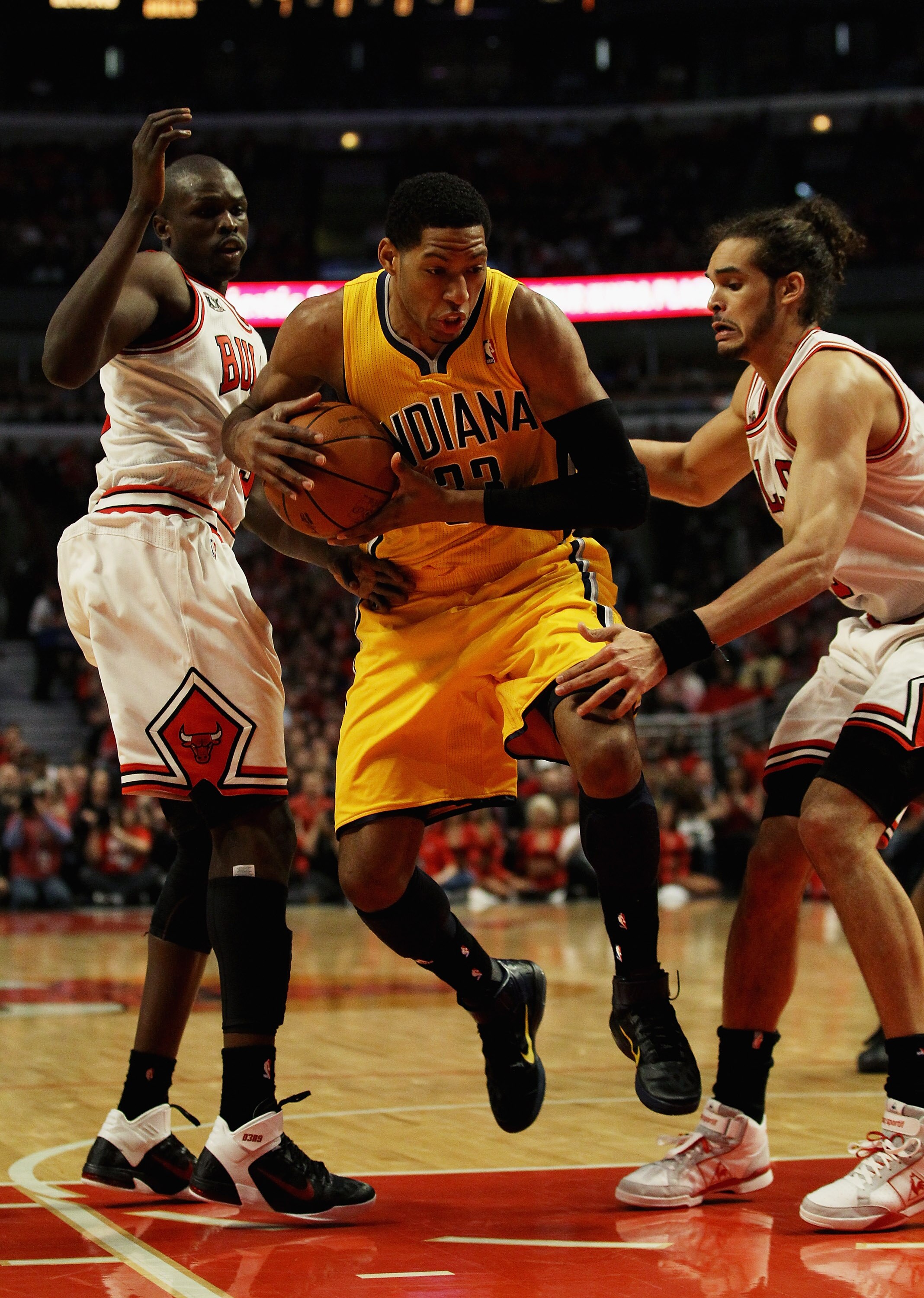 CHICAGO, IL - APRIL 26: Danny Granger #33 of the Indiana Pacers tries to move between Loul Deng #9 (L) and Joakim Noah #13 of the Chicago Bulls in Game Five of the Eastern Conference Quarterfinals in the 2011 NBA Playoffs at the United Center on April 26,