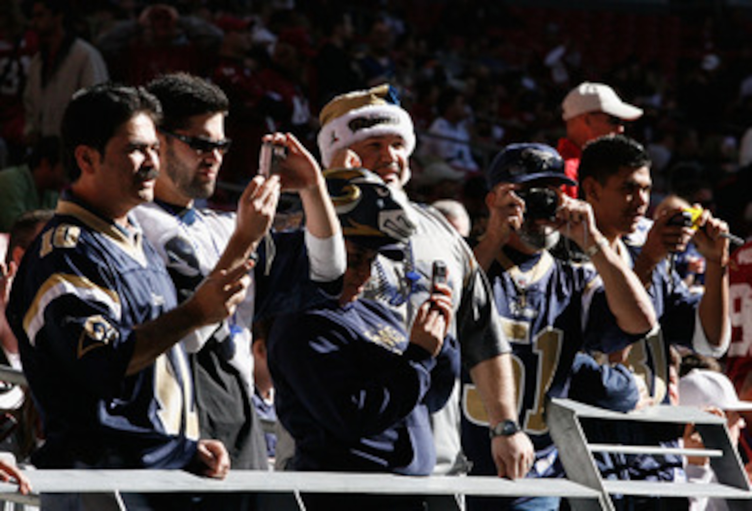 GLENDALE, AZ - DECEMBER 27:  Fans of the St. Louis Rams watch warm ups before the NFL game against the Arizona Cardinals at the Universtity of Phoenix Stadium on December 27, 2009 in Glendale, Arizona. The Cardinals defeated the Rams 31-10.  (Photo by Chr