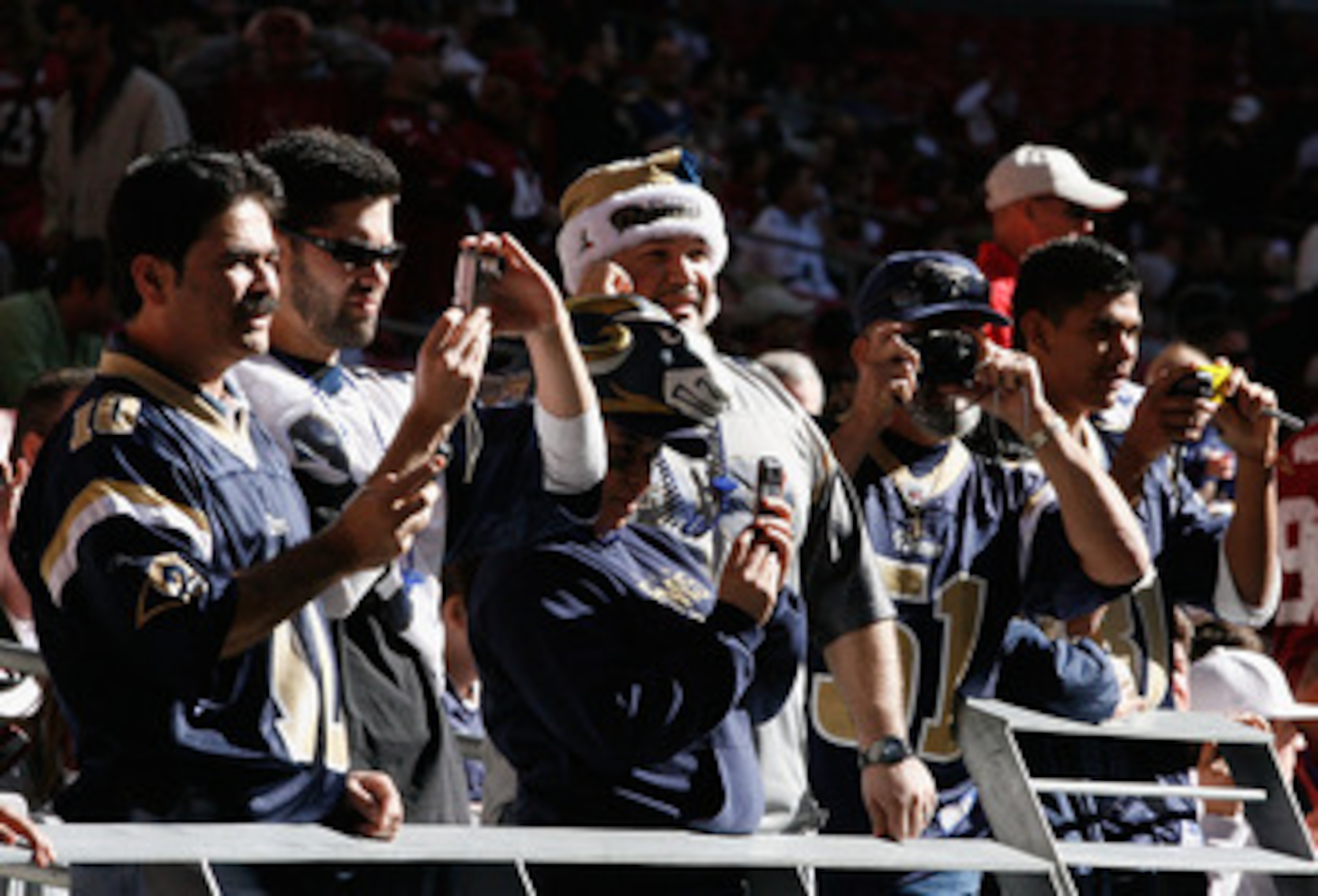 GLENDALE, AZ - DECEMBER 27:  Fans of the St. Louis Rams watch warm ups before the NFL game against the Arizona Cardinals at the Universtity of Phoenix Stadium on December 27, 2009 in Glendale, Arizona. The Cardinals defeated the Rams 31-10.  (Photo by Chr