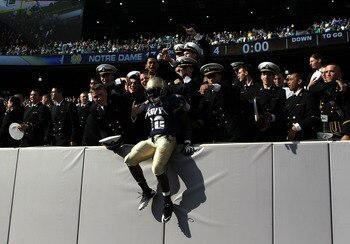 EAST RUTHERFORD, NJ - OCTOBER 23: Andre Byrd #20 of the Navy Midshipmen celebrates the win against the Notre Dame Fighting Irish at New Meadowlands Stadium on October 23, 2010 in East Rutherford, New Jersey.  (Photo by Nick Laham/Getty Images)