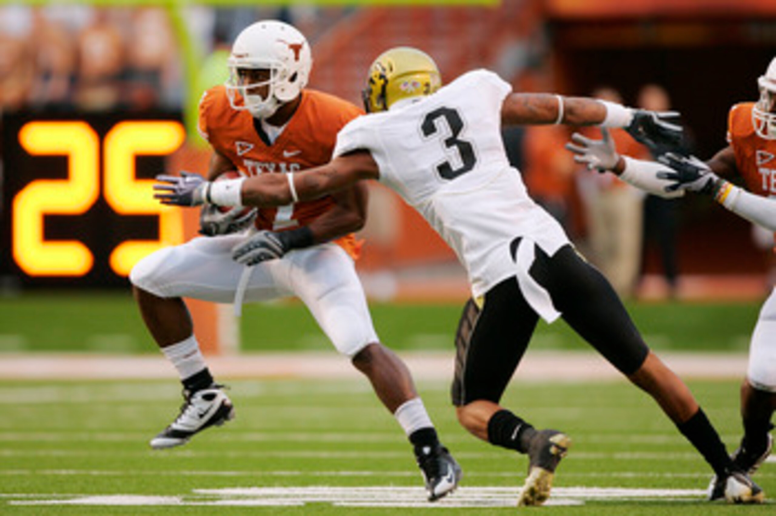 AUSTIN, TX - OCTOBER 10: Wide receiver John Chiles #7 of the Texas Longhorns makes a quick cut after catching a pass against cornerback Jimmy Smith #3 of the Colorado Buffaloes in the first quarter on October 10, 2009 at Darrell K Royal-Texas Memorial Sta
