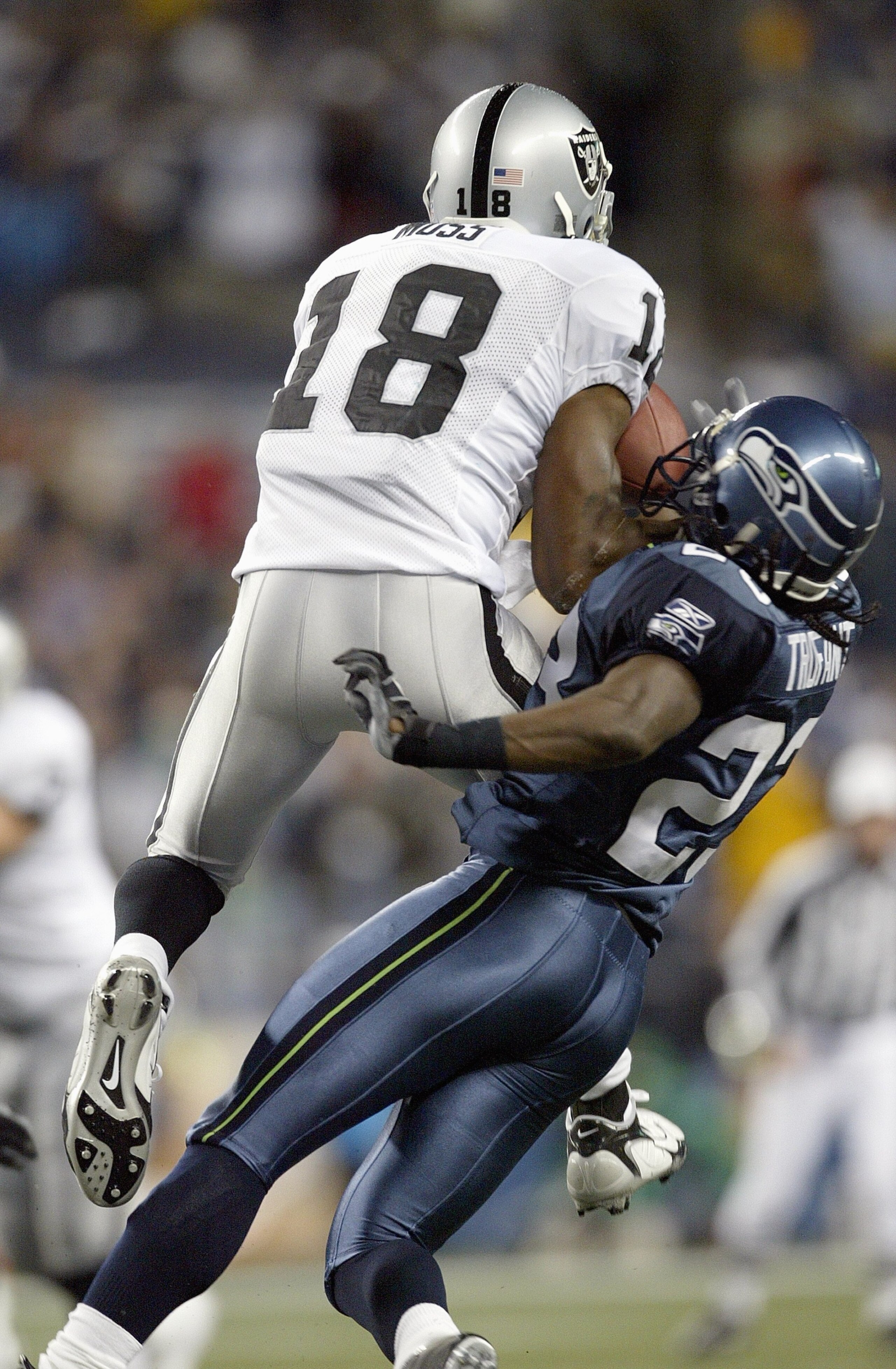 SEATTLE - NOVEMBER 6: Randy Moss #18 of the Oakland Raiders leaps against Marcus Trufant #23 of the Seattle Seahawks at Qwest Field November 6, 2006 in Seattle, Washington. The Seahawks defeated the Raiders 16-0. (Photo by Otto Greule Jr/Getty Images) SEATTLE - NOVEMBER 6: Randy Moss #18 of the Oakland Raiders leaps against Marcus Trufant #23 of the Seattle Seahawks at Qwest Field November 6, 2006 in Seattle, Washington. The Seahawks defeated the Raiders 16-0. (Photo by Otto Greule Jr/Getty Images)