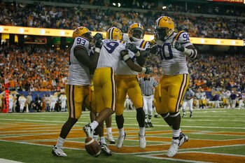 ATLANTA - DECEMBER 01: Jonathan Zenon #19 of the Louisiana State University Tigers celebrates after scoring a touchdown off an interception against the University of Tennessee Volunteers in the SEC Championship game on December 1, 2007 at the Georgia Dome