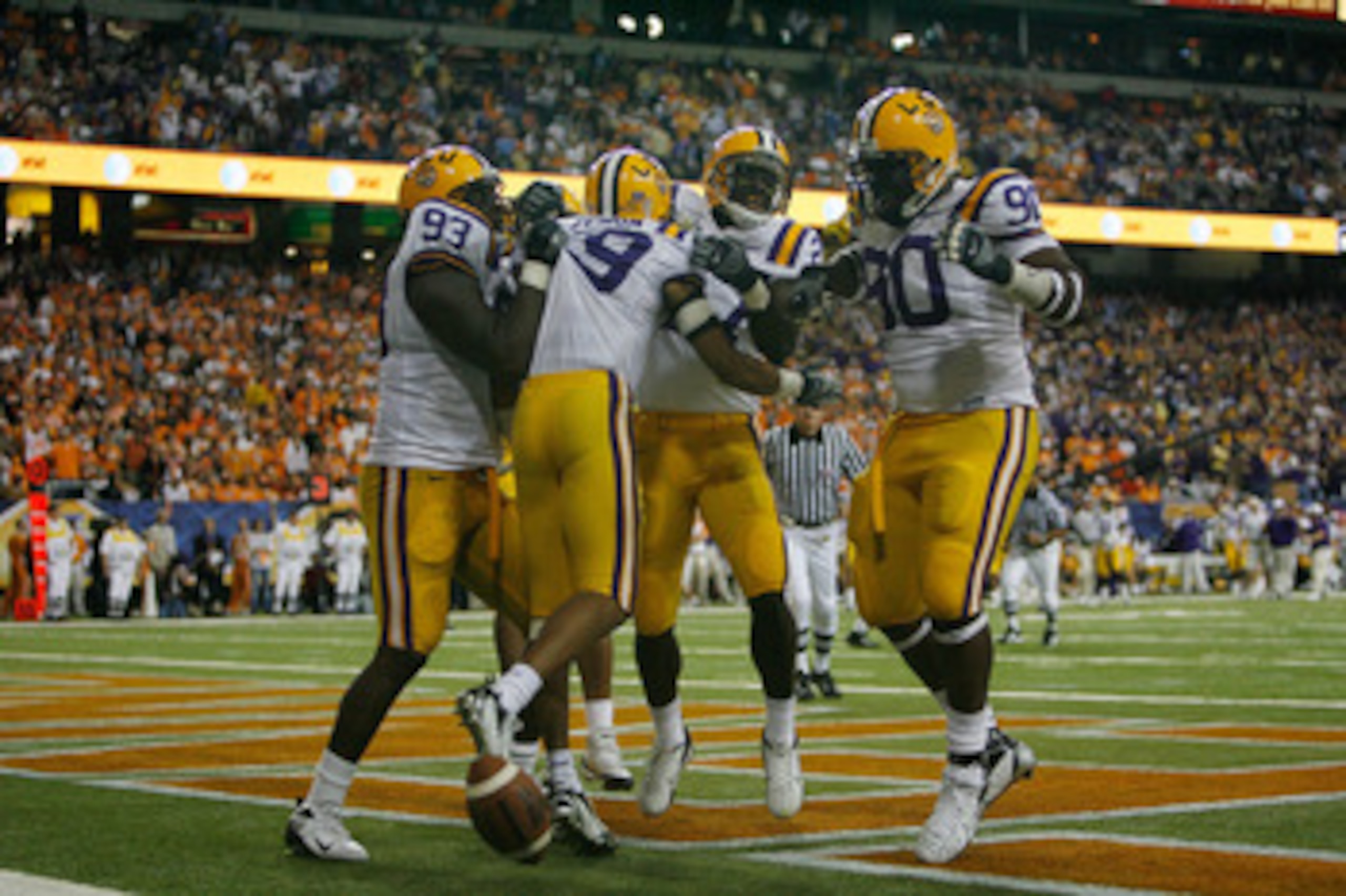 ATLANTA - DECEMBER 01: Jonathan Zenon #19 of the Louisiana State University Tigers celebrates after scoring a touchdown off an interception against the University of Tennessee Volunteers in the SEC Championship game on December 1, 2007 at the Georgia Dome ATLANTA - DECEMBER 01: Jonathan Zenon #19 of the Louisiana State University Tigers celebrates after scoring a touchdown off an interception against the University of Tennessee Volunteers in the SEC Championship game on December 1, 2007 at the Georgia Dome