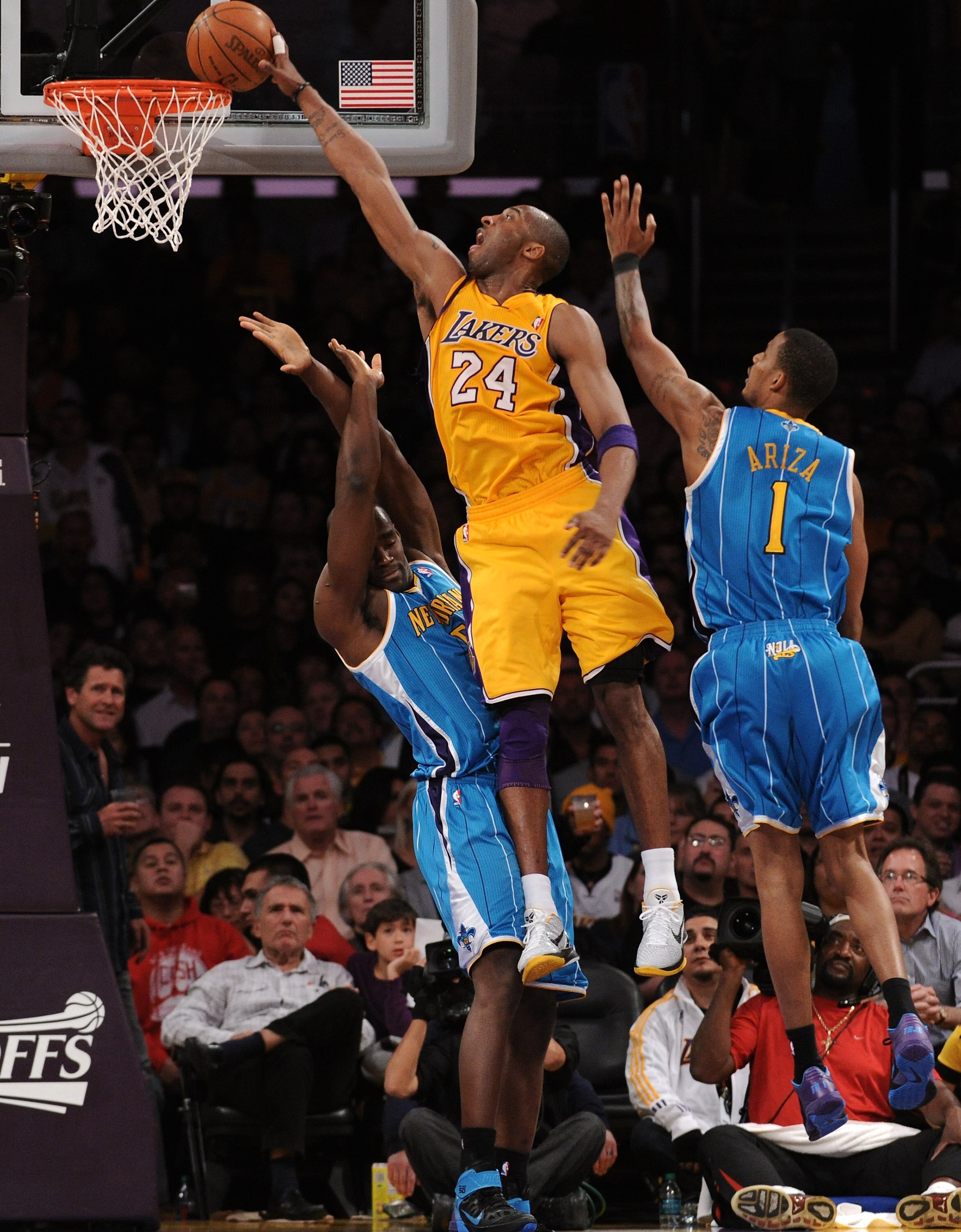 LOS ANGELES, CA - APRIL 20:  Kobe Bryant #24 of the Los Angeles Lakers goes up for a dunk over Emeka Okafor #50 of the New Orleans Hornets in Game Two of the Western Conference Quarterfinals in the 2011 NBA Playoffs on April 20, 2011 at Staples Center in