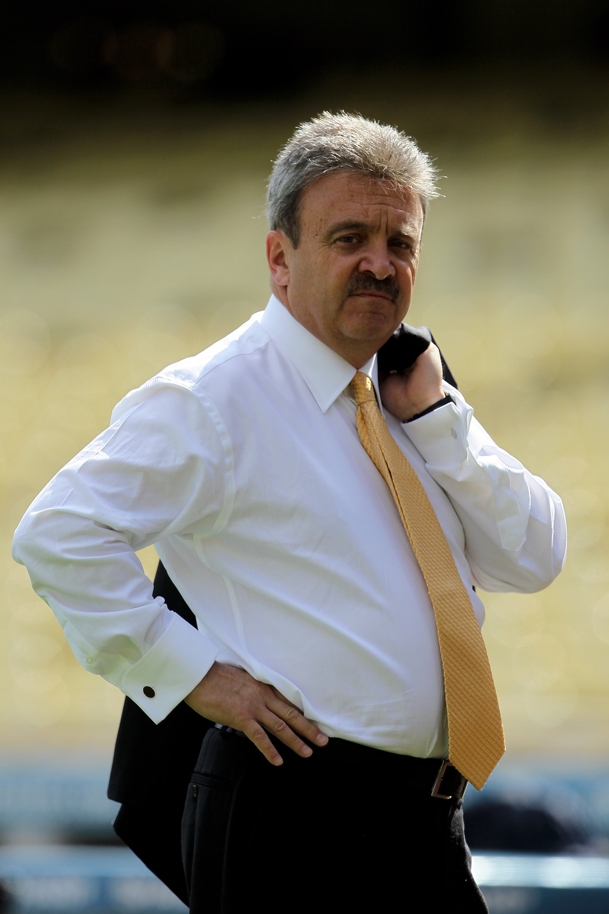 LOS ANGELES, CA - APRIL 13: Los Angeles Dodgers' general manager Ned Colletti looks on prior to the start of the game against the Arizona Diamondbacks at Dodger Stadium on April 13, 2010 in Los Angeles, California. The Dodgers defeated the Diamondbacks 9 LOS ANGELES, CA - APRIL 13: Los Angeles Dodgers' general manager Ned Colletti looks on prior to the start of the game against the Arizona Diamondbacks at Dodger Stadium on April 13, 2010 in Los Angeles, California. The Dodgers defeated the Diamondbacks 9