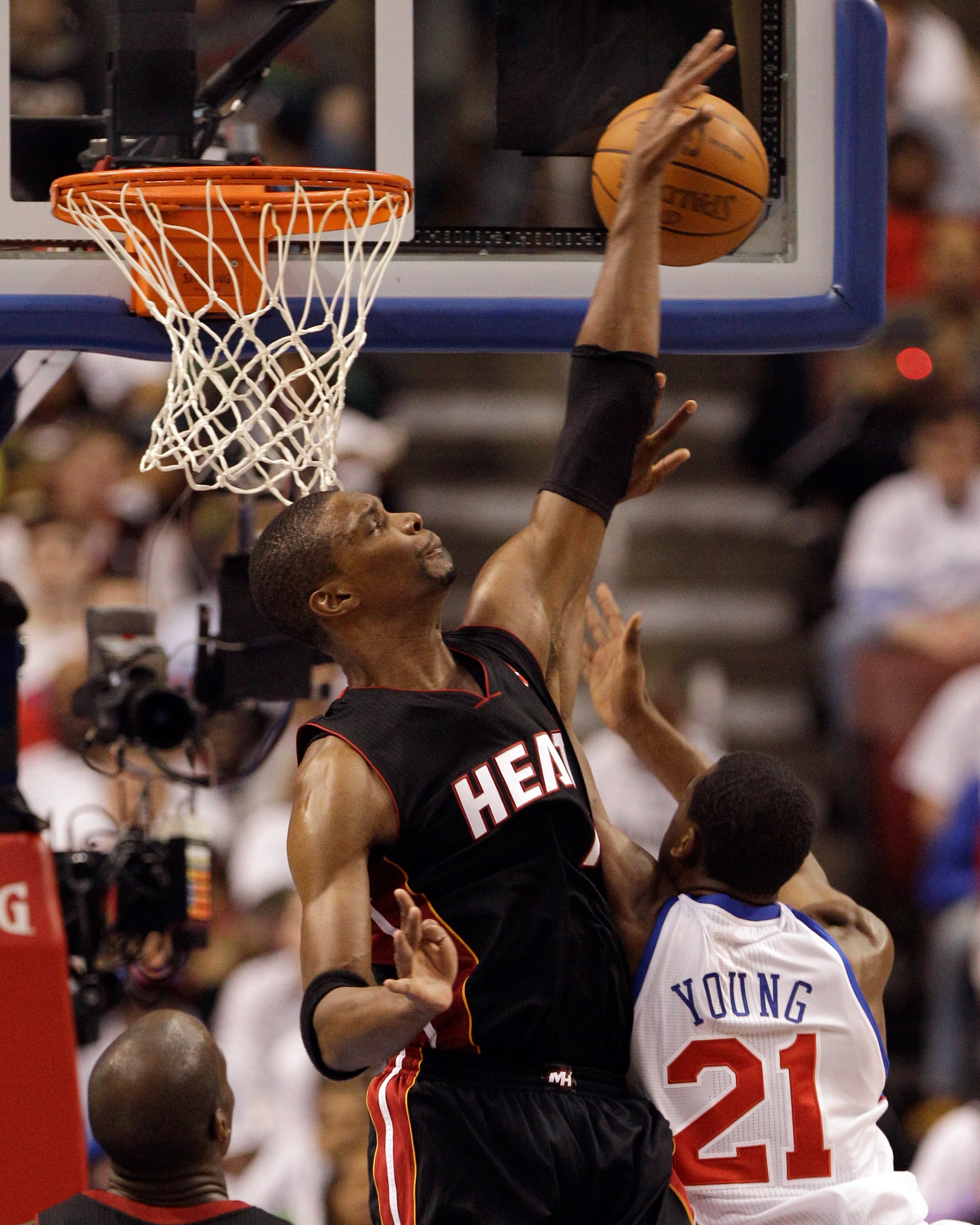PHILADELPHIA, PA - APRIL 21: Chris Bosh #1 of the Miami Heat blocks a shot by Thaddeus Young #21 of the Philadelphia 76ers during the first half of game three of the Eastern Conference Quarterfinals at Wells Fargo Center on April 21, 2011 in Philadelphia,