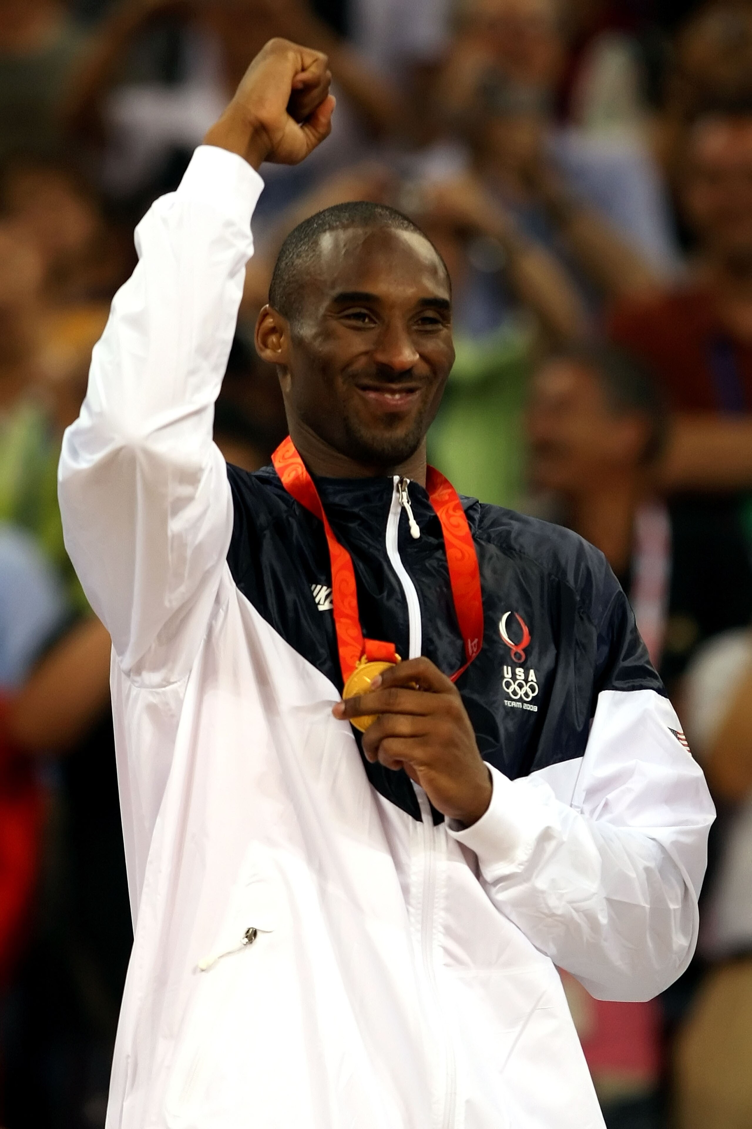 BEIJING - AUGUST 24:  Kobe Bryant #10 of the United States celebrates on the podium after defeating Spain 118-107 in the gold medal game during Day 16 of the Beijing 2008 Olympic Games at the Beijing Olympic Basketball Gymnasium on August 24, 2008 in Beij