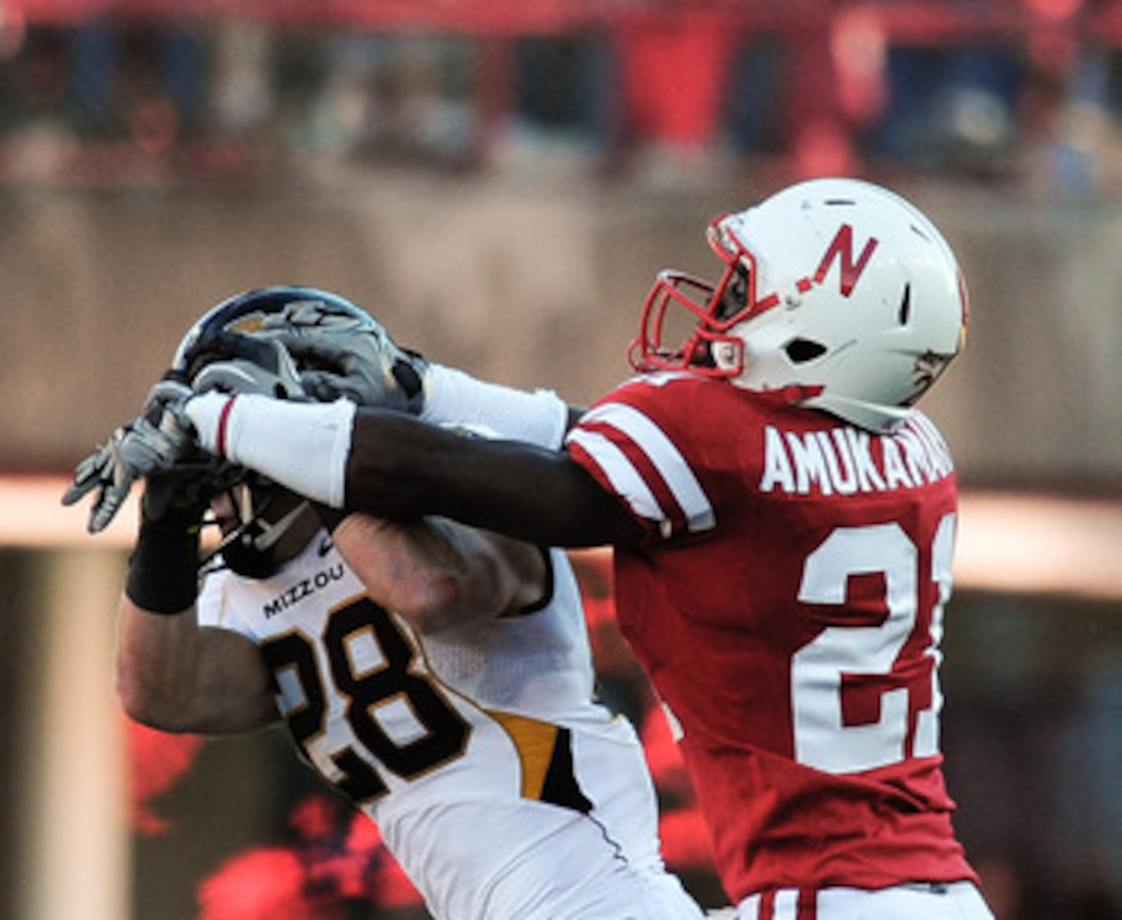 LINCOLN, NE - OCTOBER 30: Cornerback Prince Amukamara #21 of the Nebraska Cornhuskers breaks up a pass intended for wide receiver T.J. Moe #28 of the Missouri Tigers during first half action of their game at Memorial Stadium on October 30, 2010 in Lincoln