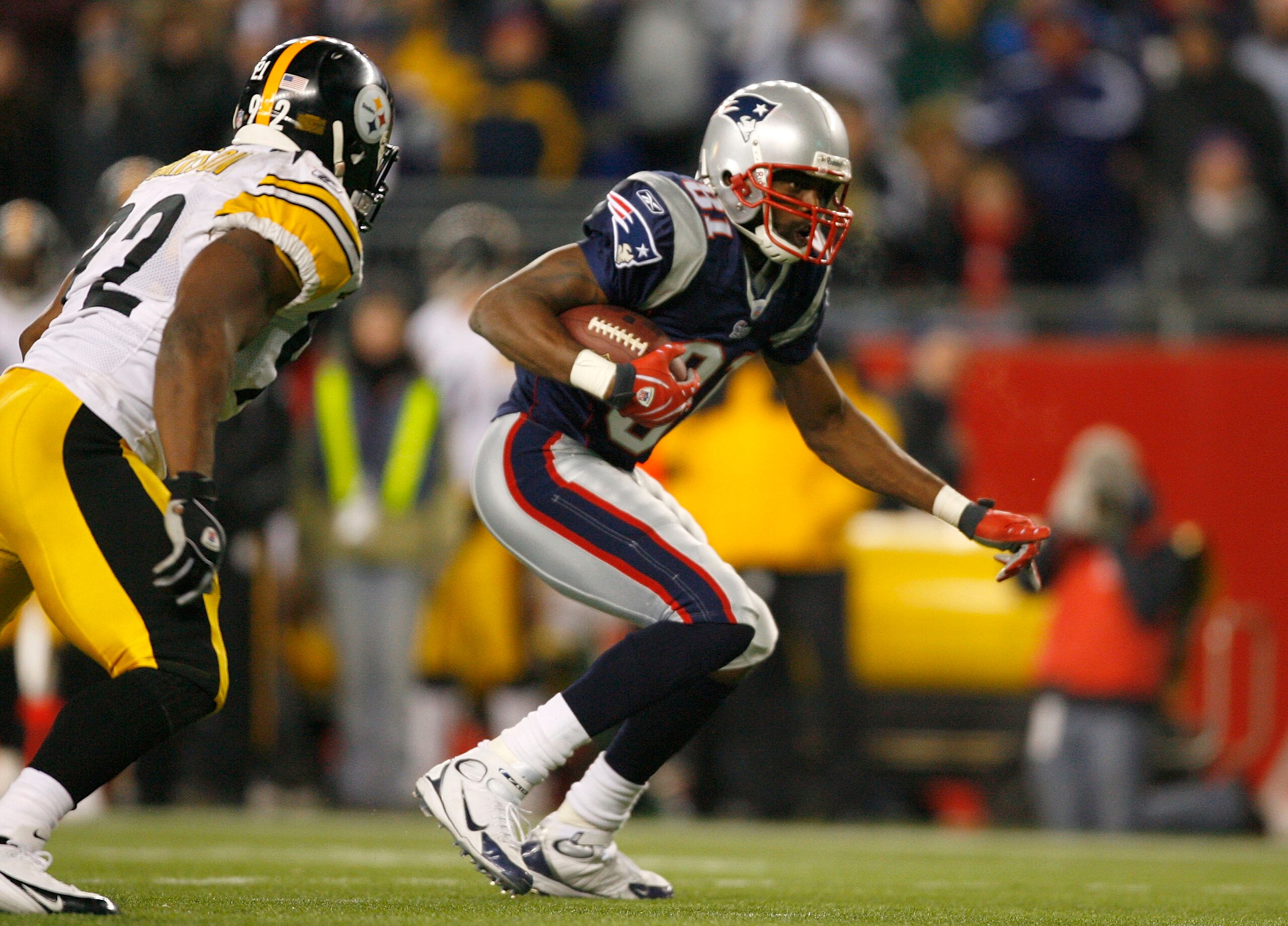 FOXBORO, MA - DECEMBER 9: Randy Moss #81 of the New England Patriots gains yards against James Harrison #92 of the Pittsburgh Steelers after a penalty was called in the third quarter at Gillette Stadium December 9, 2007 in Foxboro, Massachusetts. The Pa FOXBORO, MA - DECEMBER 9: Randy Moss #81 of the New England Patriots gains yards against James Harrison #92 of the Pittsburgh Steelers after a penalty was called in the third quarter at Gillette Stadium December 9, 2007 in Foxboro, Massachusetts. The Pa