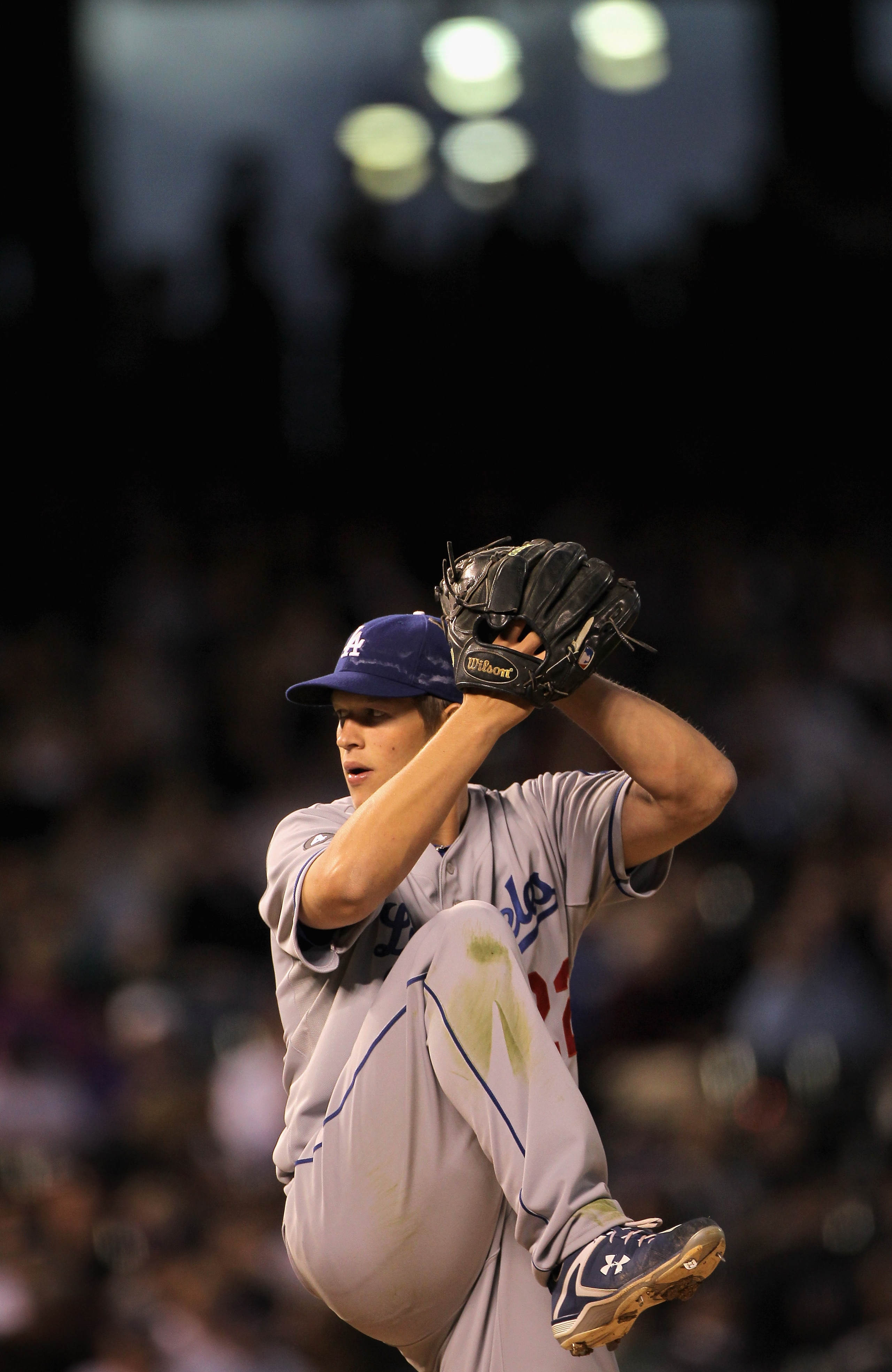 DENVER, CO - APRIL 05:  Starting pitcher Clayton Kershaw #22 of the Los Angeles Dodgers delivers against the Colorado Rockies at Coors Field on April 5, 2011 in Denver, Colorado. Kershaw collected the loss as the Rockies defeated the Dodgers 3-0.  (Photo