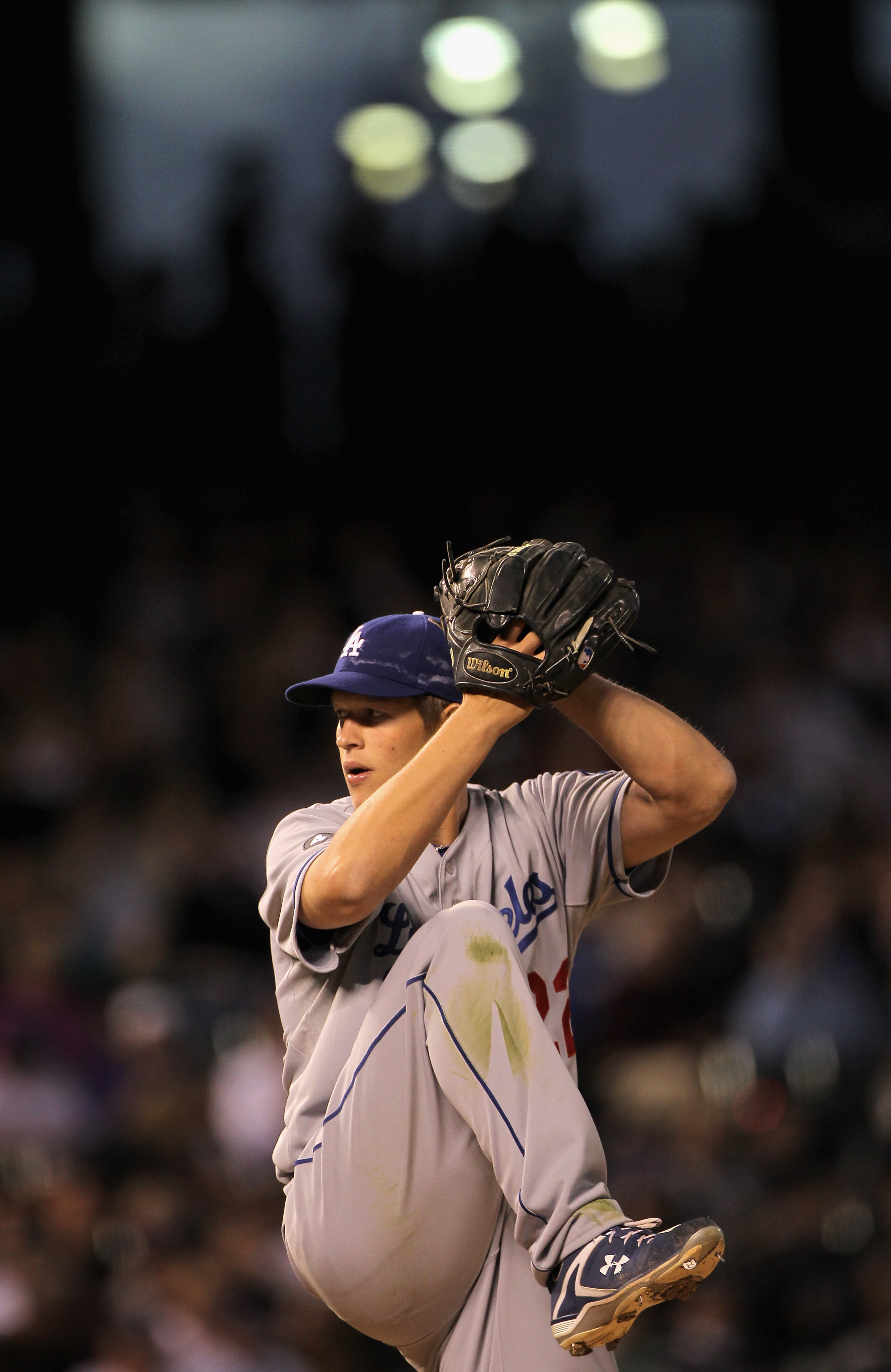 DENVER, CO - APRIL 05:  Starting pitcher Clayton Kershaw #22 of the Los Angeles Dodgers delivers against the Colorado Rockies at Coors Field on April 5, 2011 in Denver, Colorado. Kershaw collected the loss as the Rockies defeated the Dodgers 3-0.  (Photo