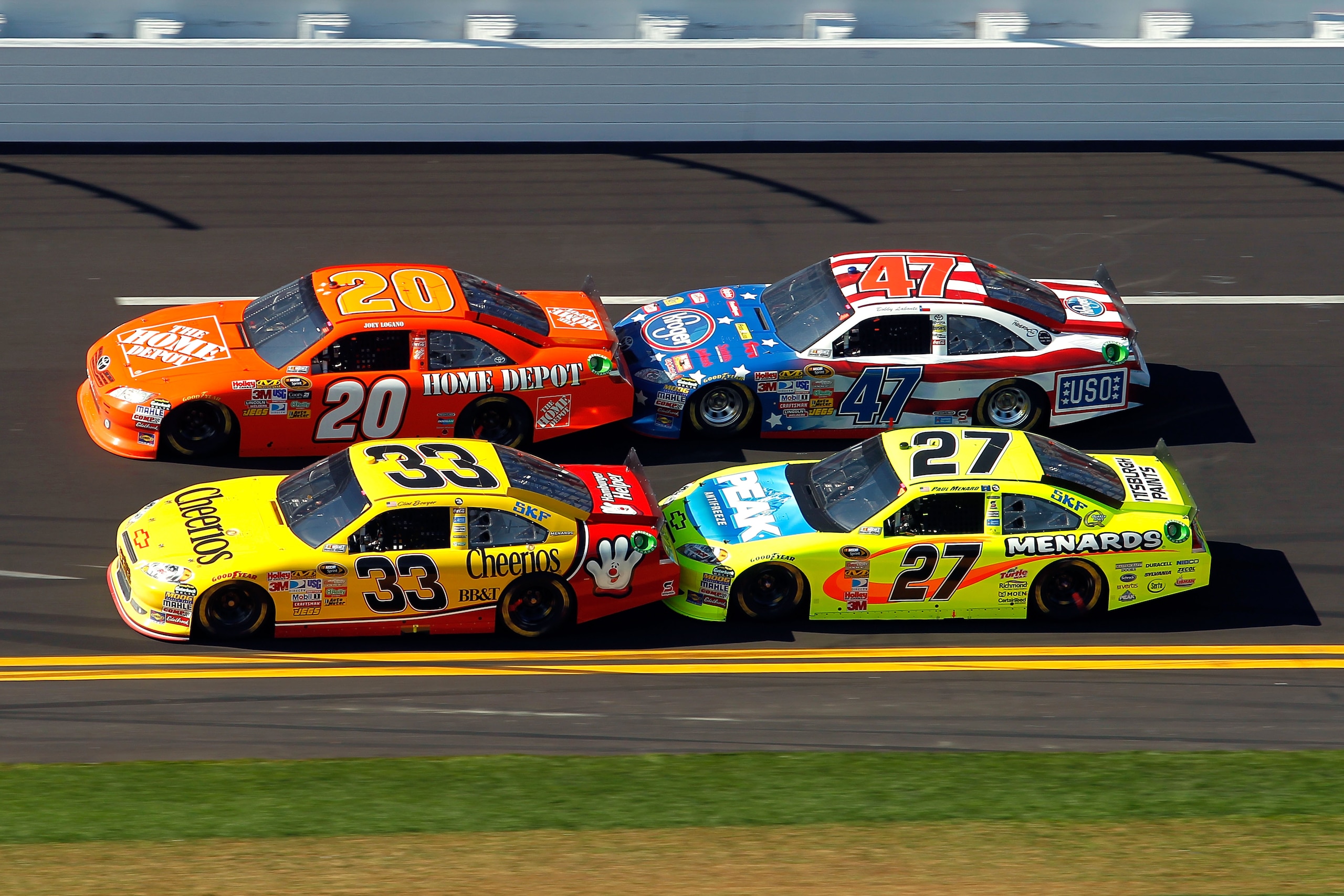 DAYTONA BEACH, FL - FEBRUARY 20: Joey Logano, driver of the #20 Home Depot Toyota, Bobby Labonte, driver of the #47 Kroger/USO Toyota, Clint Bowyer, driver of the #33 Cheerios Chevrolet, and Paul Menard, driver of the #27 Menards Chevrolet, race during t DAYTONA BEACH, FL - FEBRUARY 20: Joey Logano, driver of the #20 Home Depot Toyota, Bobby Labonte, driver of the #47 Kroger/USO Toyota, Clint Bowyer, driver of the #33 Cheerios Chevrolet, and Paul Menard, driver of the #27 Menards Chevrolet, race during t