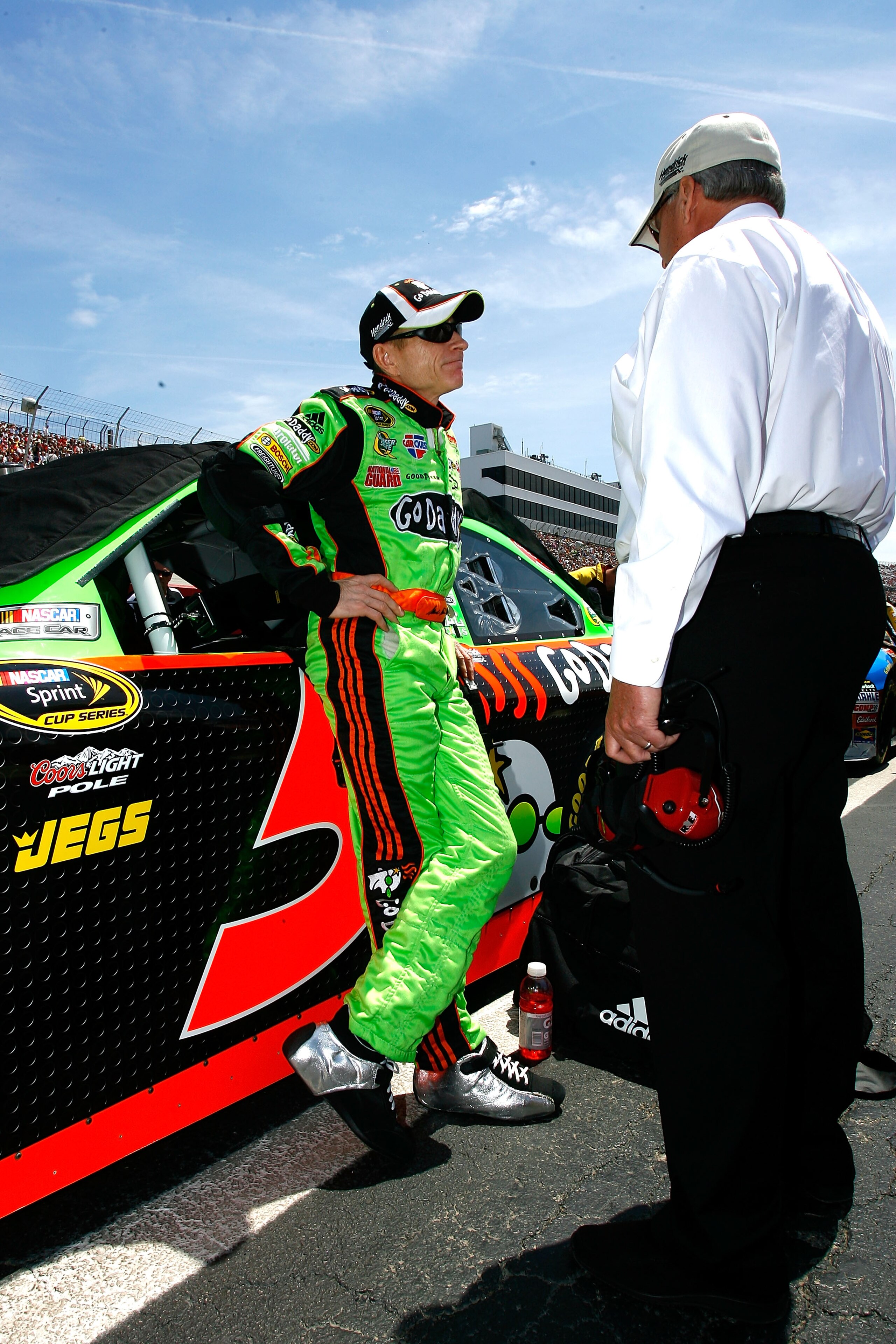 DOVER, DE - MAY 16: Team owner Rick Hendrick (R), and Mark Martin, driver of the #5 GoDaddy.com Chevrolet, talk by his car on the grid prior to the NASCAR Sprint Cup Series Autism Speaks 400 at Dover International Speedway on May 16, 2010 in Dover, Delaw DOVER, DE - MAY 16: Team owner Rick Hendrick (R), and Mark Martin, driver of the #5 GoDaddy.com Chevrolet, talk by his car on the grid prior to the NASCAR Sprint Cup Series Autism Speaks 400 at Dover International Speedway on May 16, 2010 in Dover, Delaw