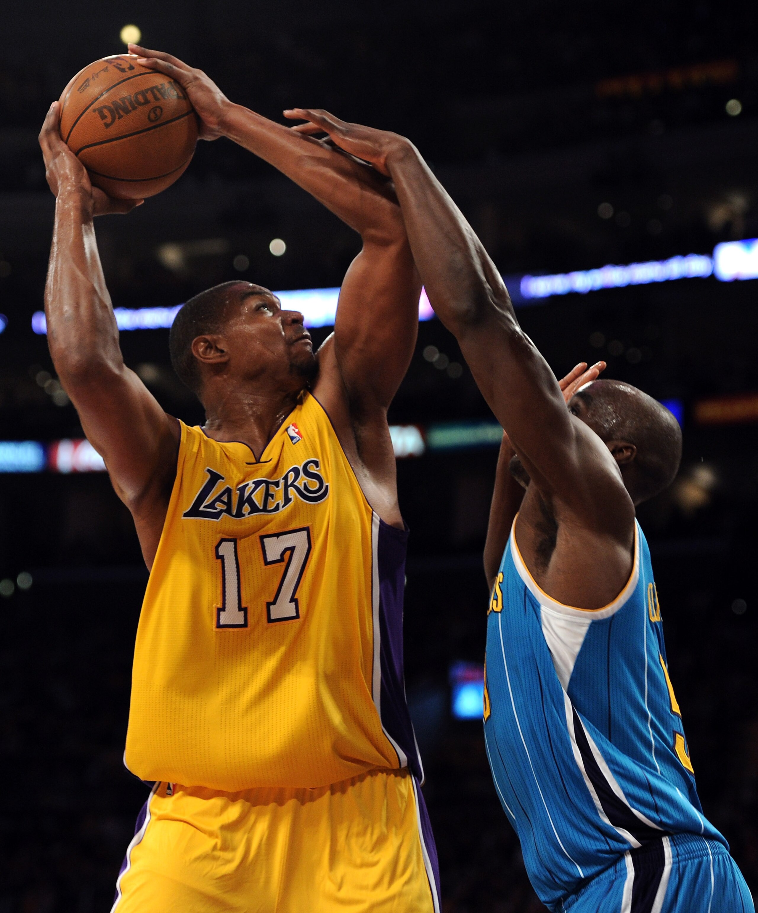 LOS ANGELES, CA - APRIL 26:  Andrew Bynum #17 of the Los Angeles Lakers looks to shoot over Emeka Okafor #50 of the New Orleans Hornets in the first quarter in Game Five of the Western Conference Quarterfinals in the 2011 NBA Playoffs on April 26, 2011 at
