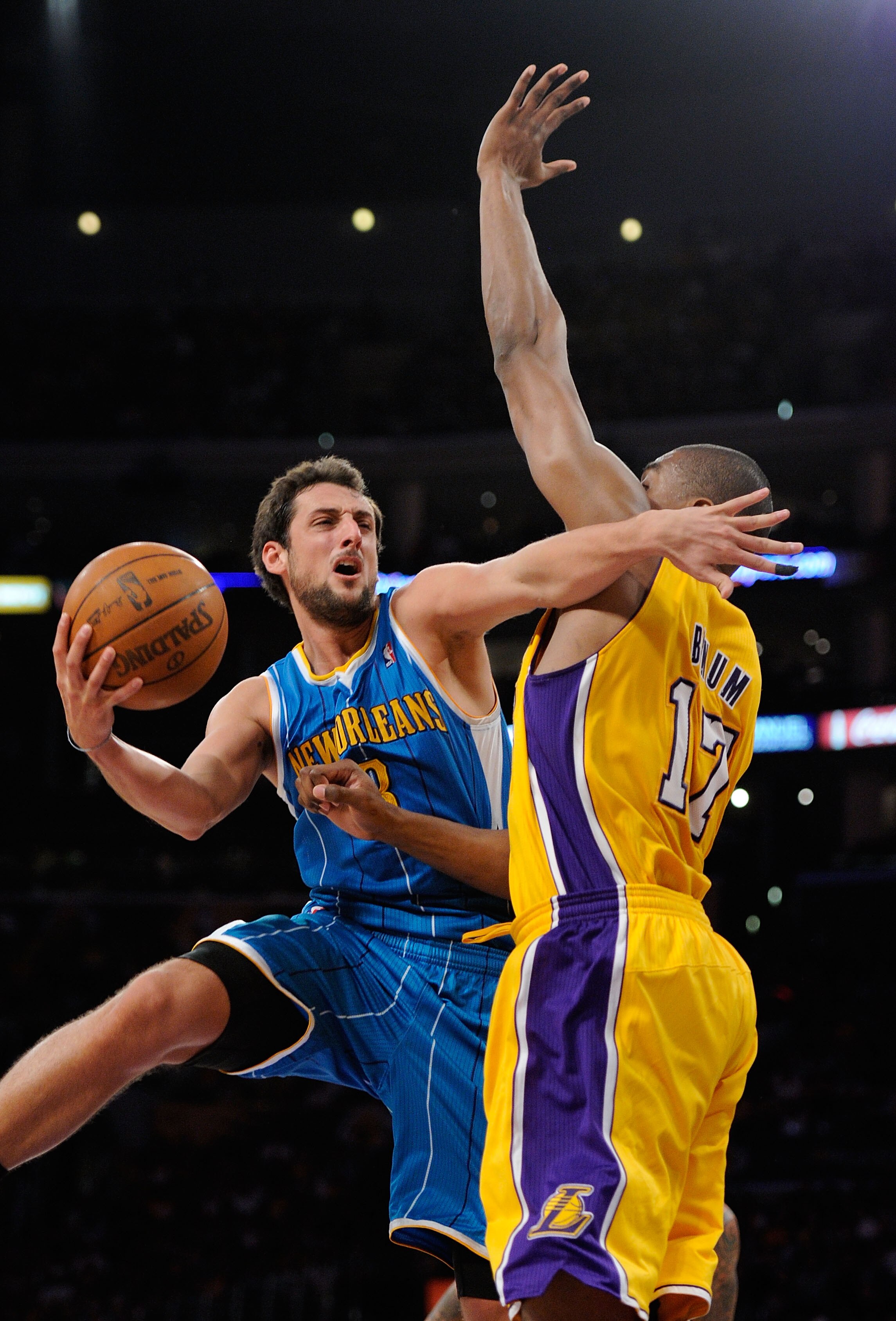 LOS ANGELES, CA - APRIL 20:  Marco Belinelli #8 of the New Orleans Hornets goes up for a shot against Andrew Bynum #17 of the Los Angeles Lakers in Game Two of the Western Conference Quarterfinals in the 2011 NBA Playoffs on April 20, 2011 at Staples Cent